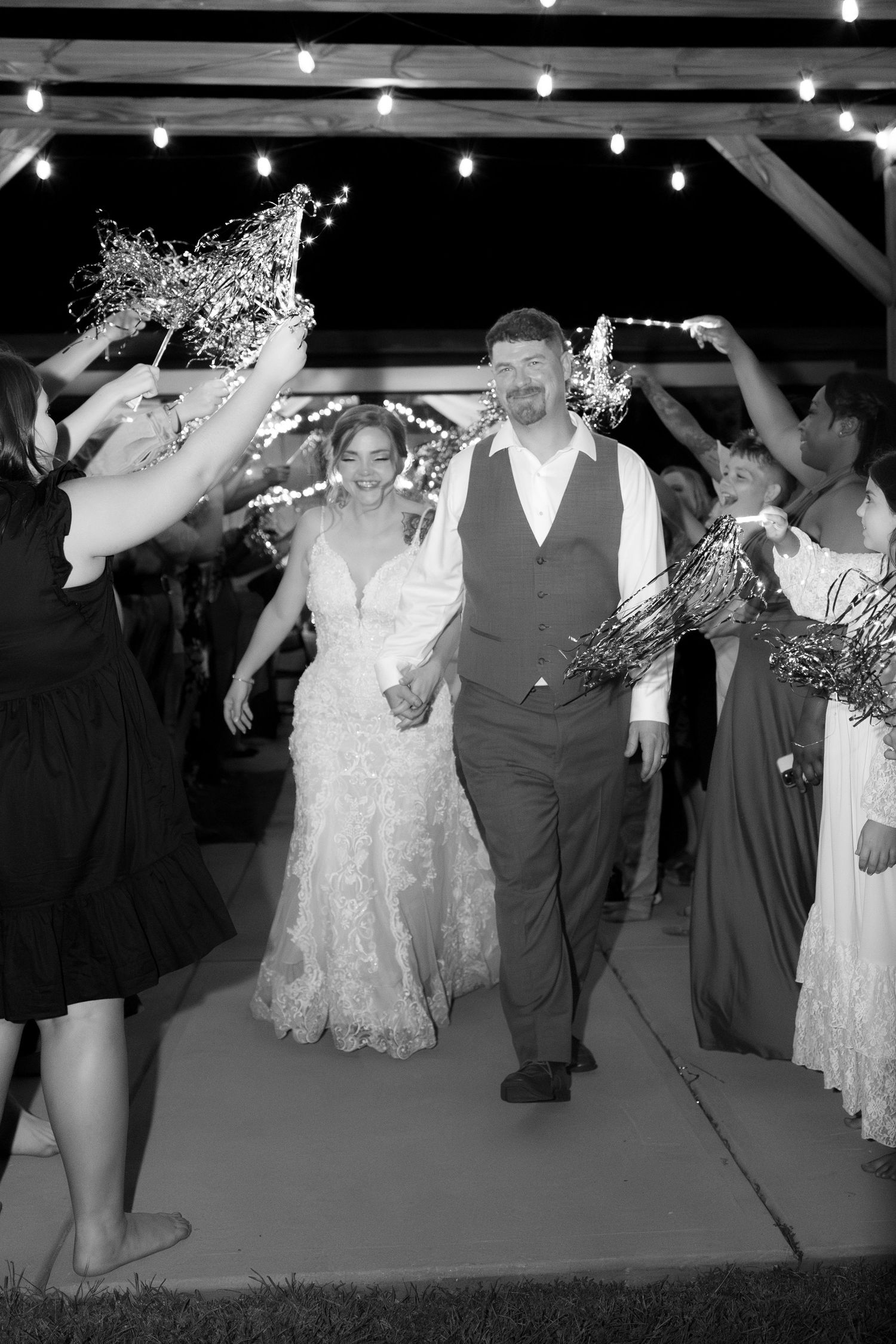 Bride and groom exit through sparklers at their wedding at Hilltop Acres Wicksburg, Alabama