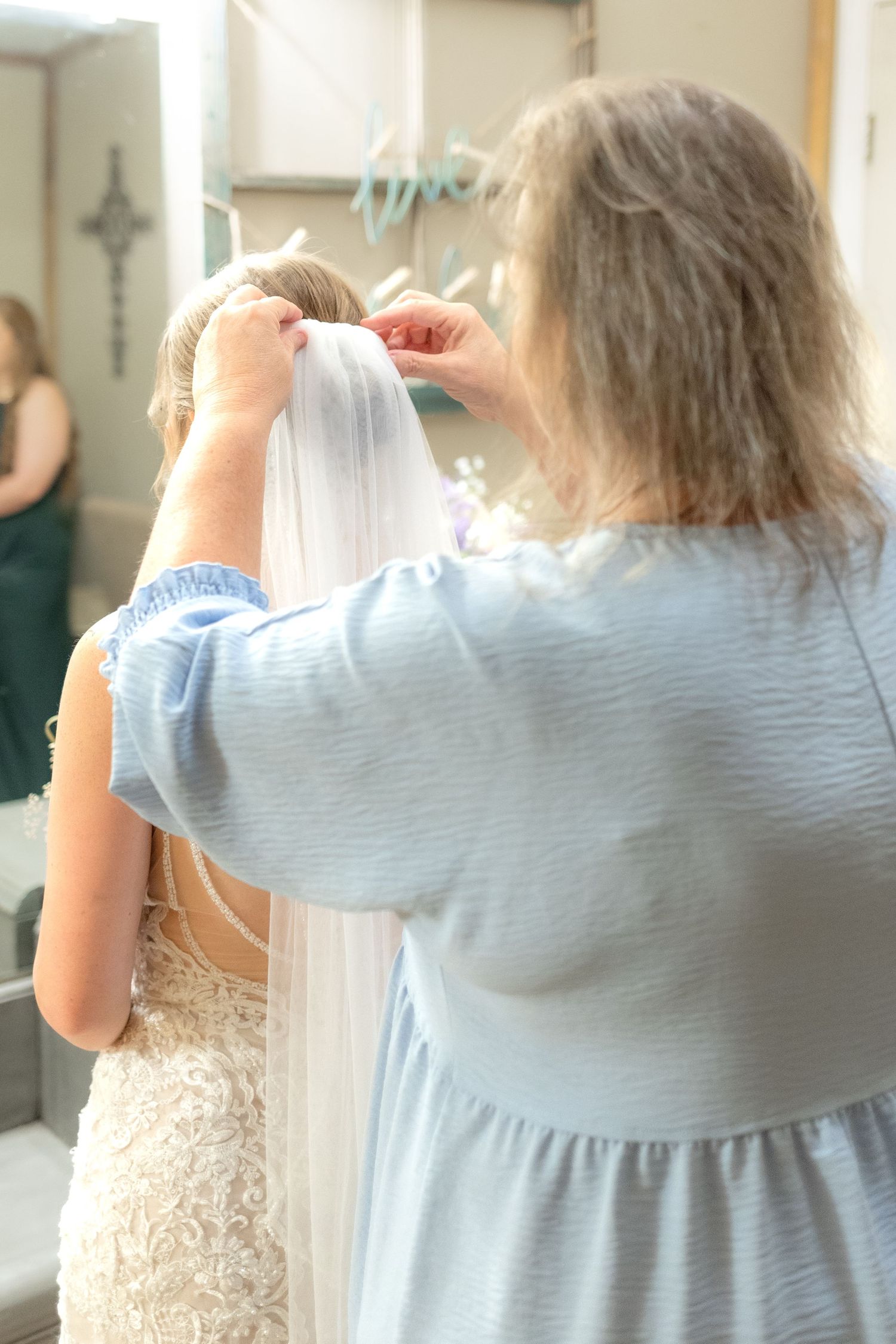 Bride getting ready on her wedding day at Hilltop Acres Wicksburg, Alabama