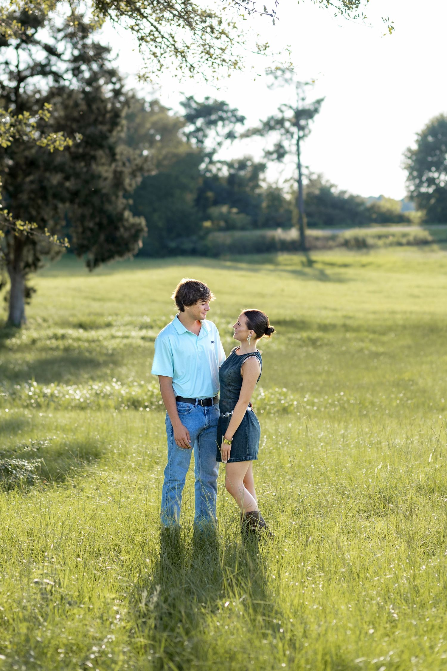 Romantic Couples photos in a tall grass field at sunset near Dothan, Alabama
