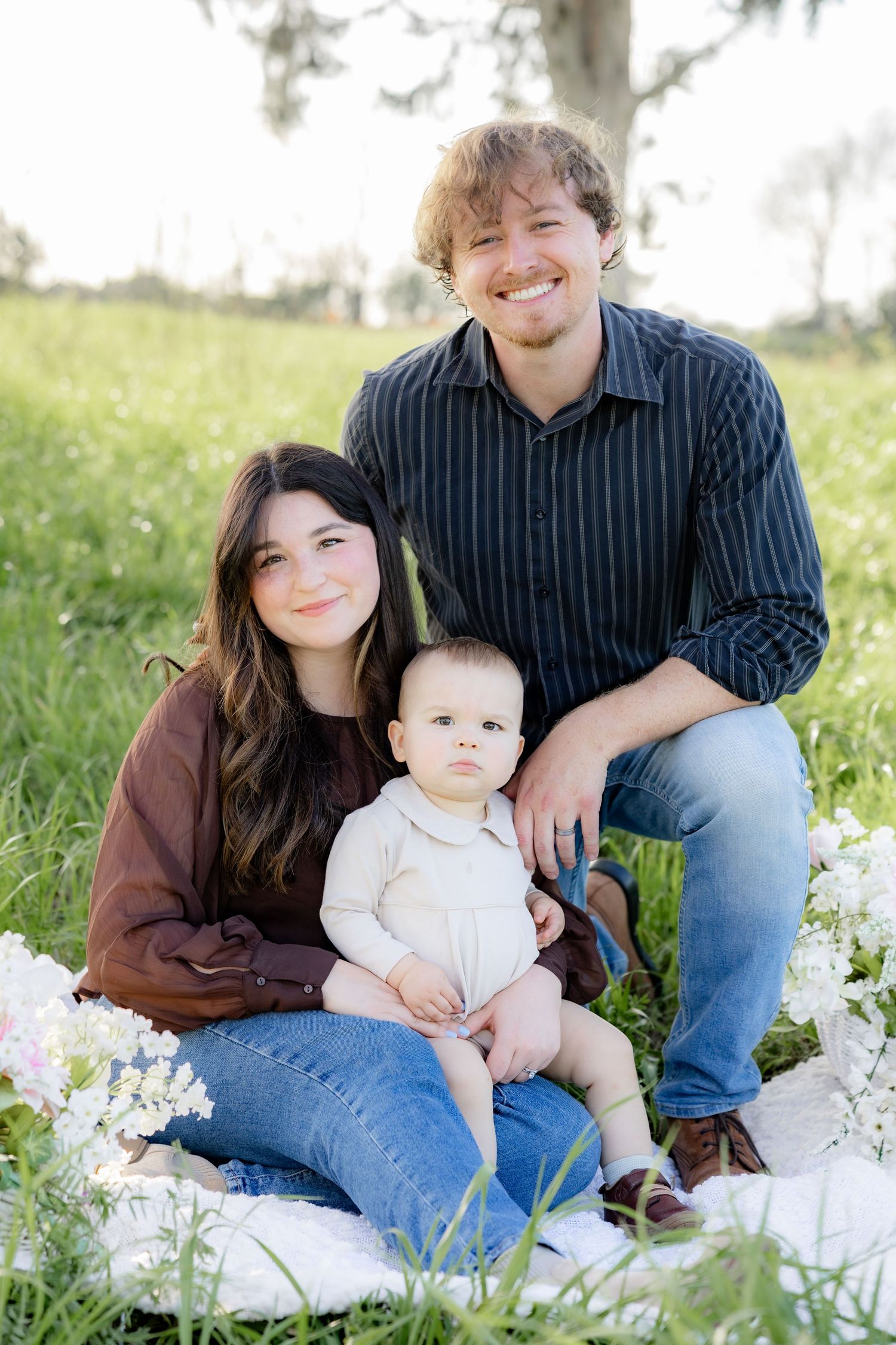 Spring Mini Session with baby chicks in a grass field at sunset near Dothan, Alabama