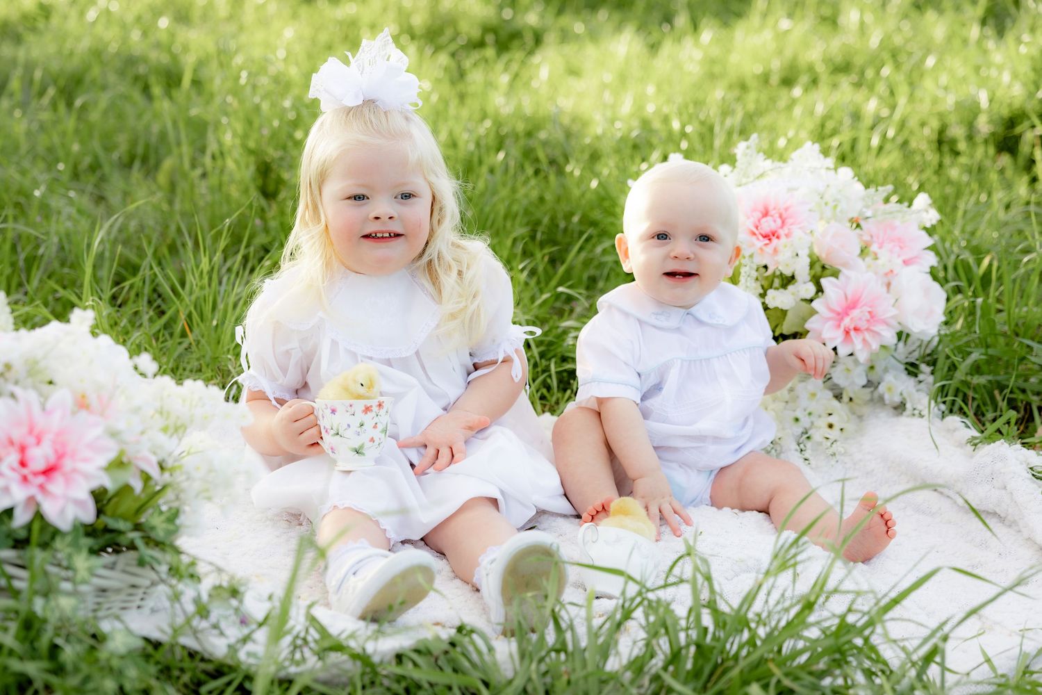 Spring Mini Session with baby chicks in a grass field at sunset near Dothan, Alabama