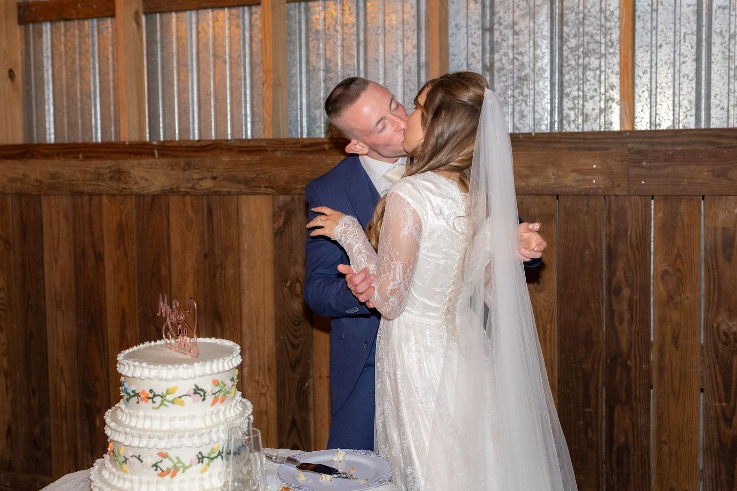 Bride and groom cut cake at their reception at Dalrymple Farms Enterprise, Alabama