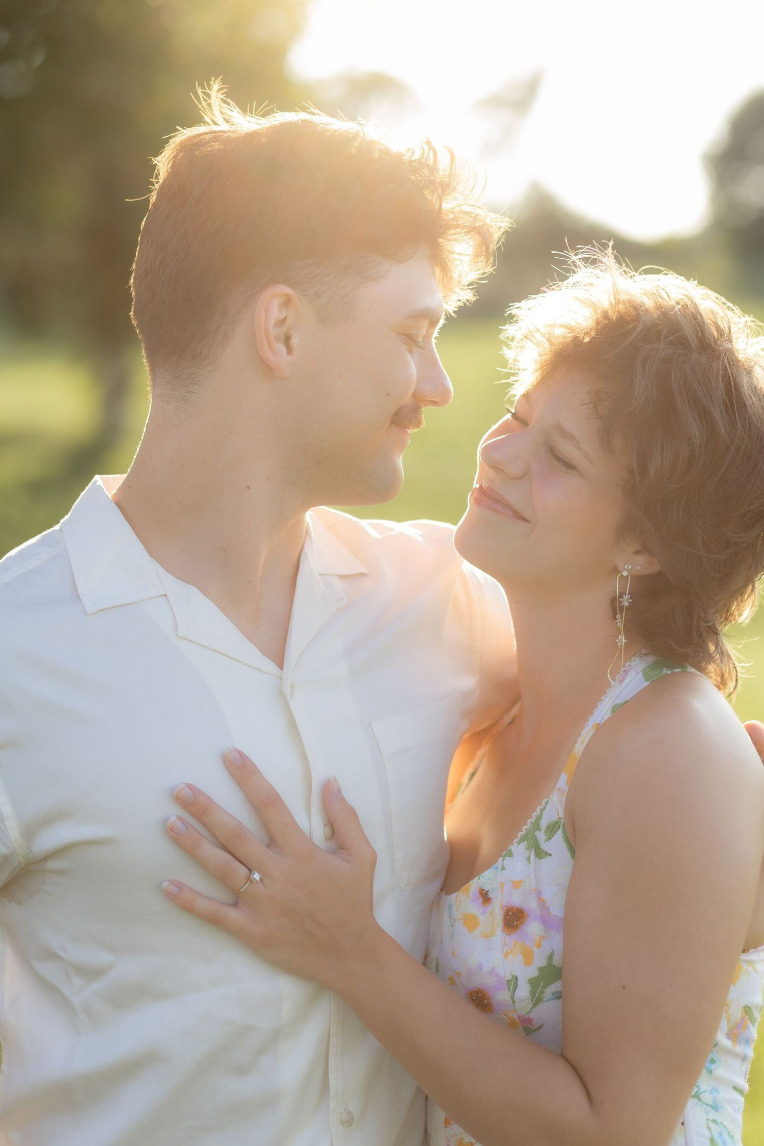 Romantic Couples photos in a tall grass field at sunset near Dothan, Alabama