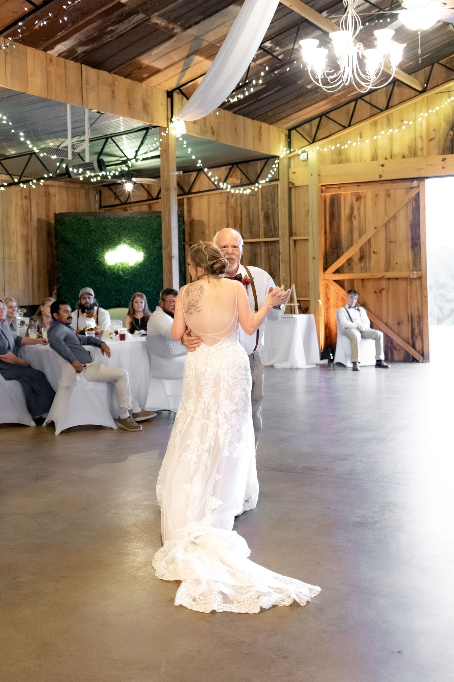 Bride and grandfather dance at a wedding at Hilltop Acres Wicksburg, Alabama