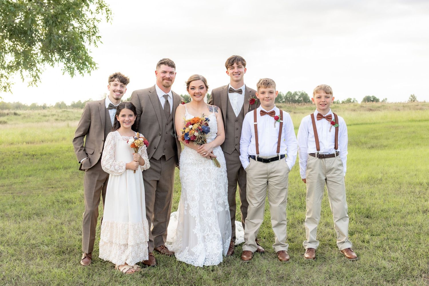 Bride and groom family portraits in a field at Hilltop Acres Wicksburg, Alabama