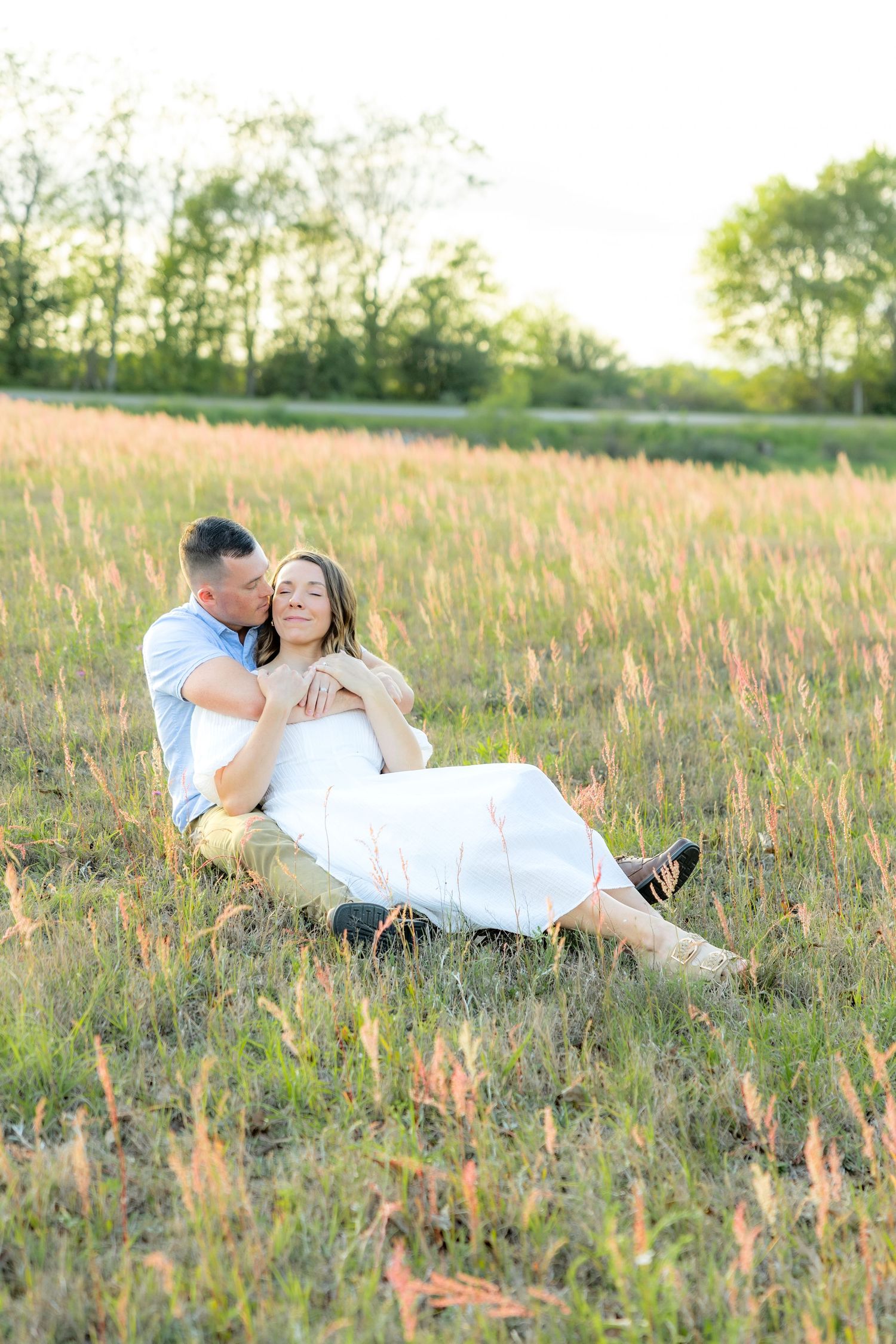 Storytelling couple photos in a tall grass field at sunset in Dothan, Alabama