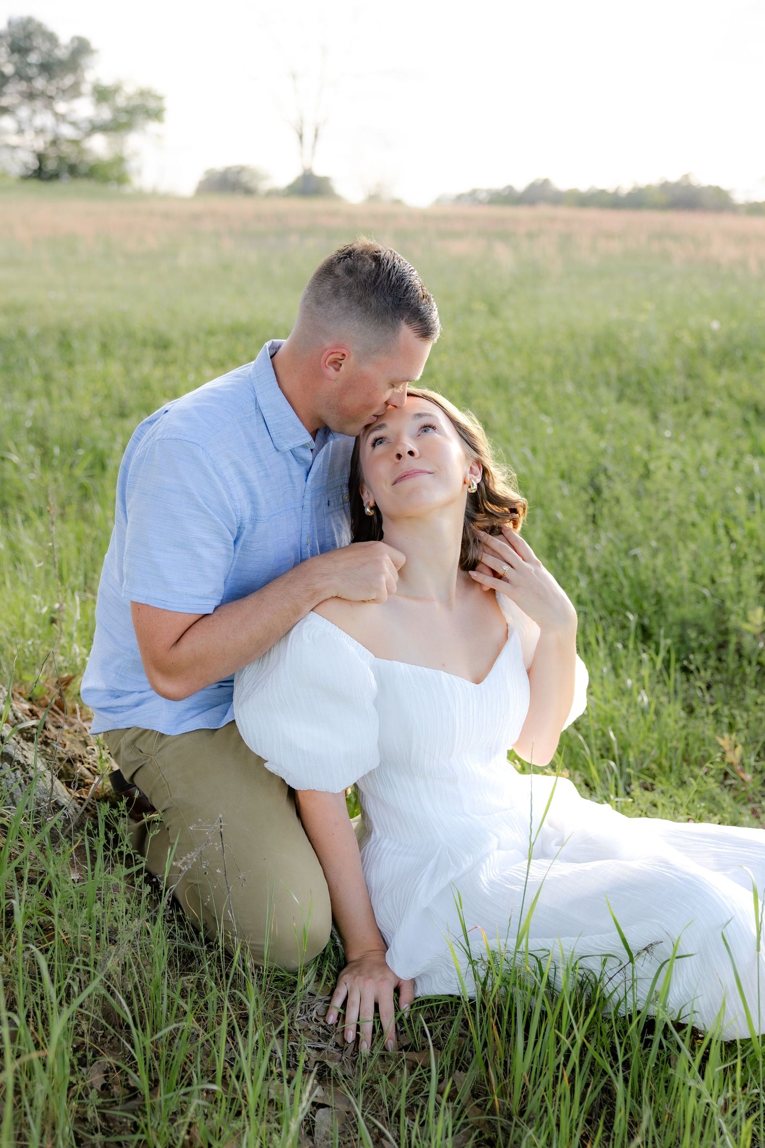 Storytelling couple photos in a tall grass field at sunset in Dothan, Alabama