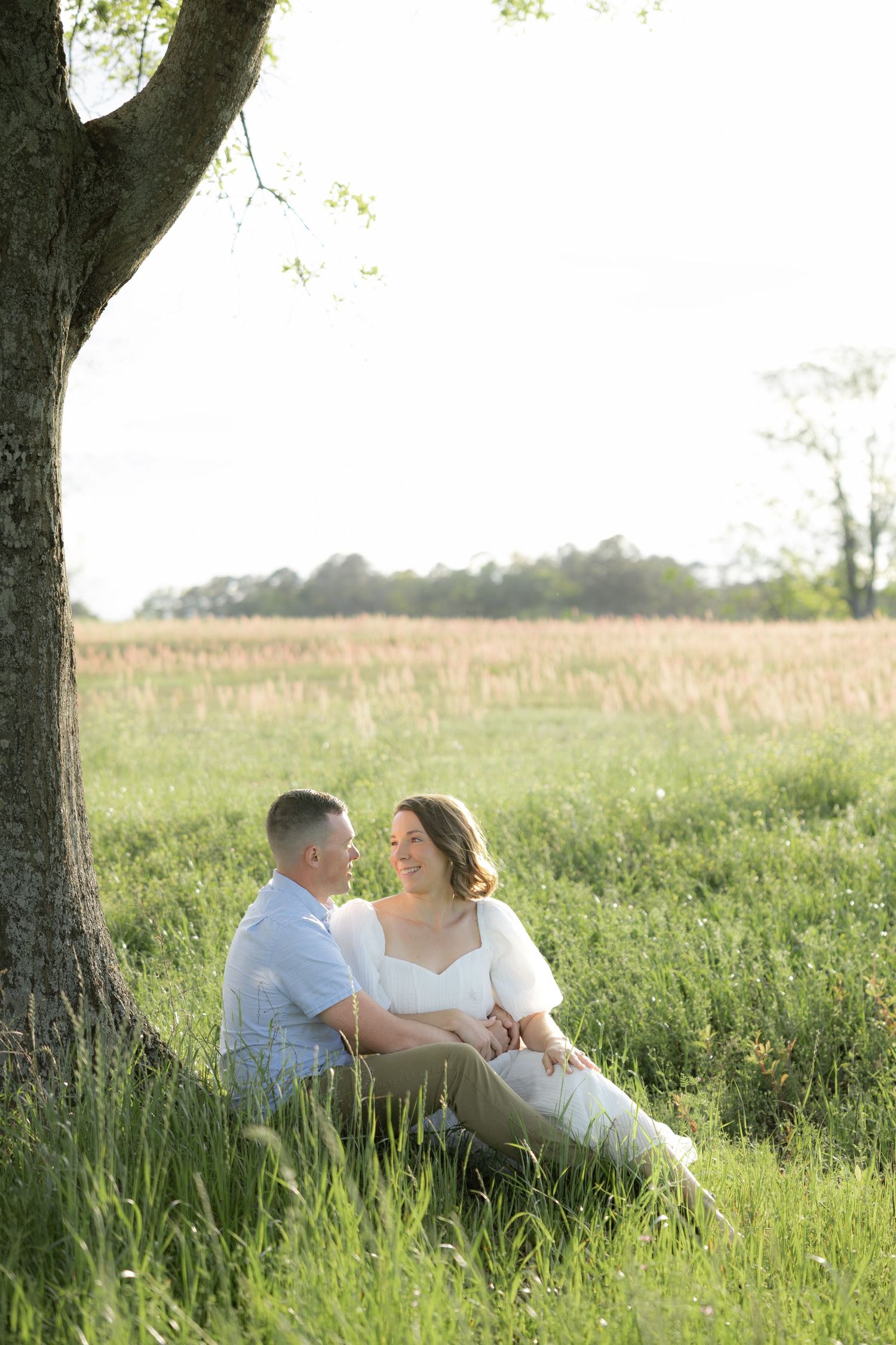 Storytelling romantic couple photos in a tall grass field at sunset in Dothan, Alabama