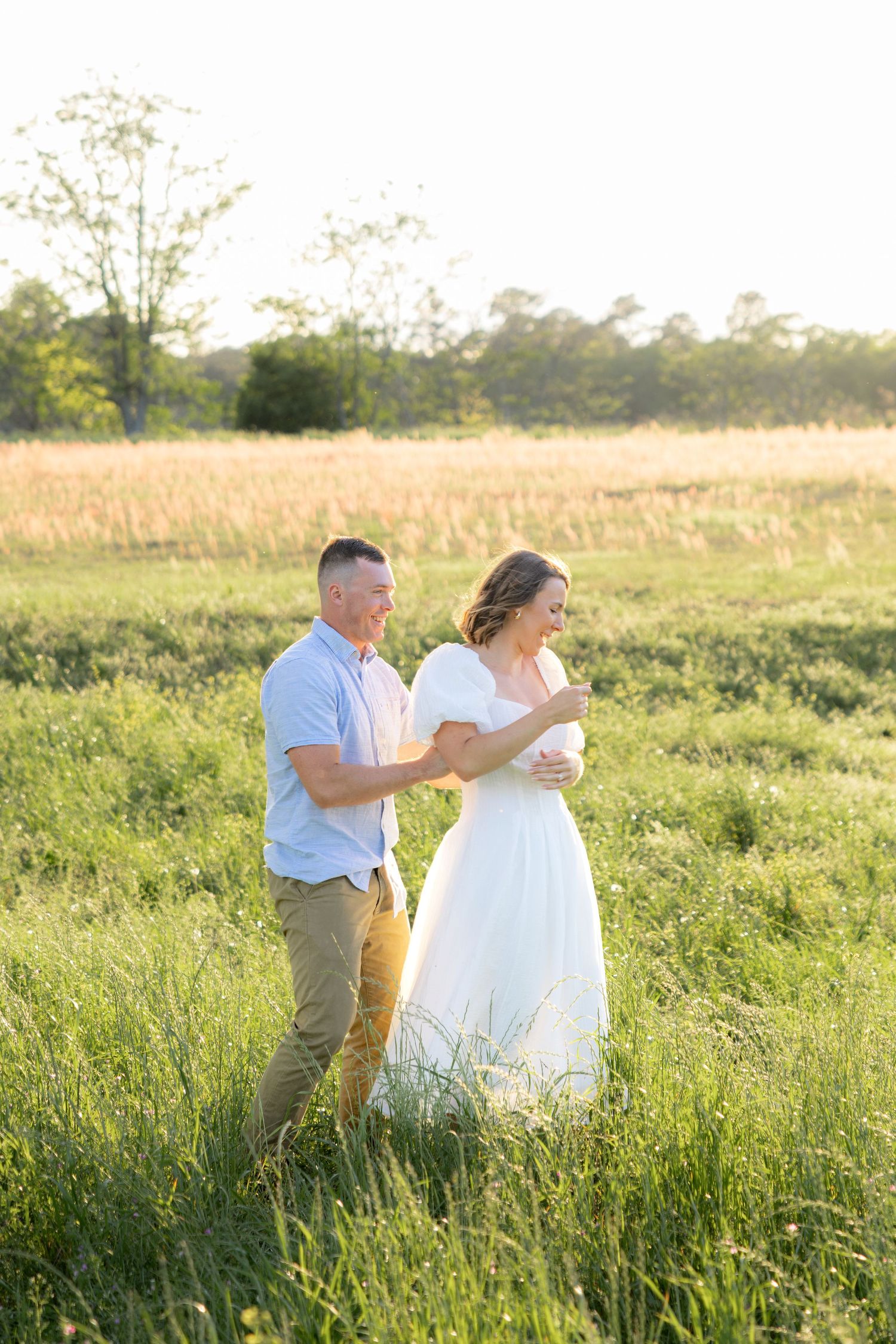 Storytelling couple photos in a tall grass field at sunset in Dothan, Alabama