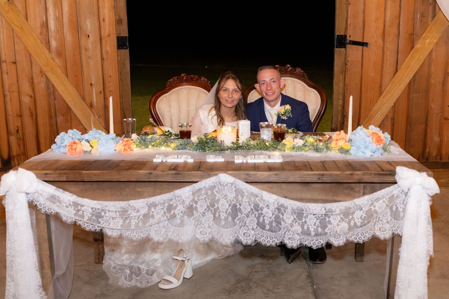 Bride and groom pose for a photo at their reception at Dalrymple Farms Enterprise, Alabama