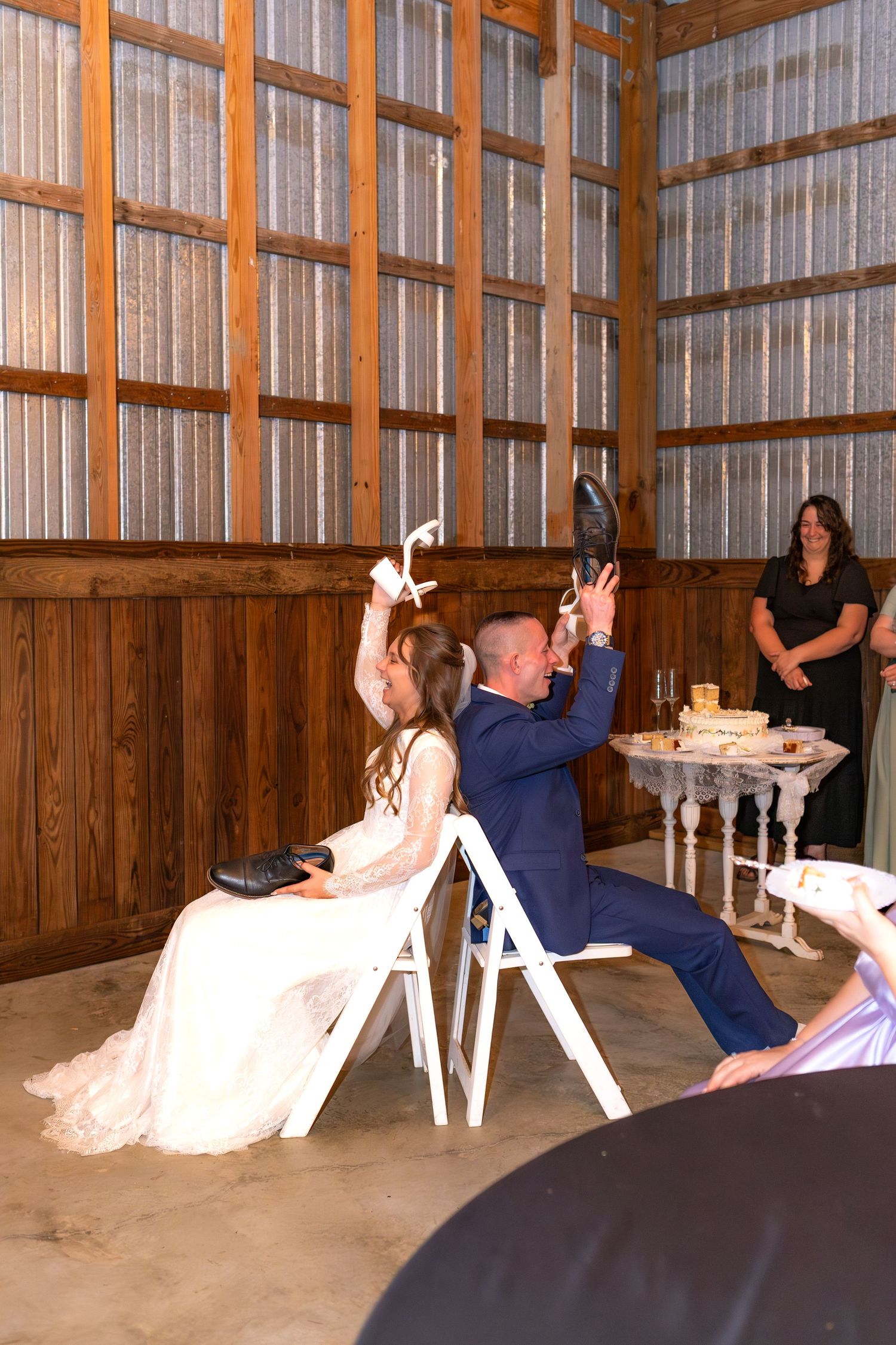 Bride and groom play the shoe game at their reception at Dalrymple Farms Enterprise, Alabama