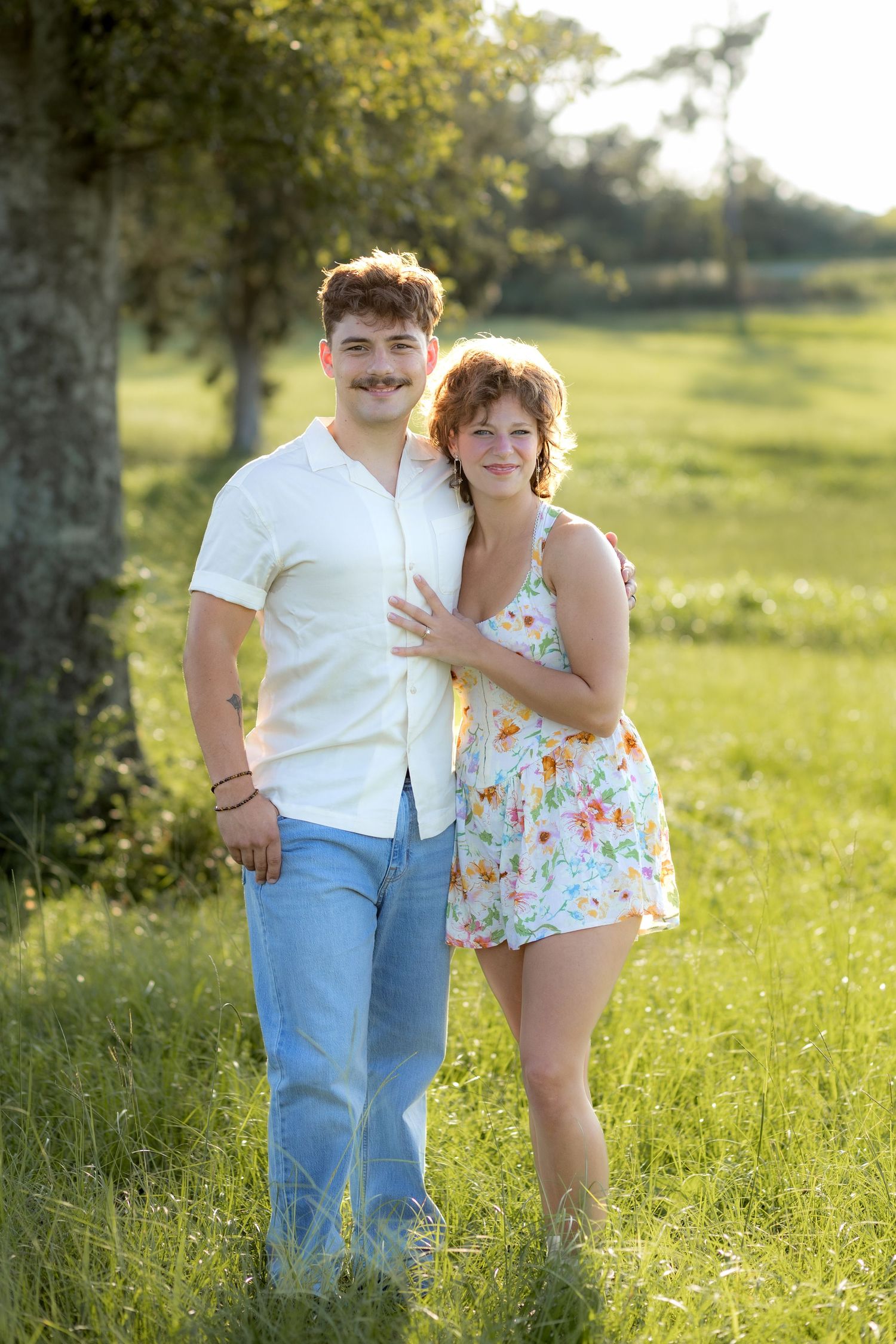 Romantic Couples photos in a tall grass field at sunset near Dothan, Alabama