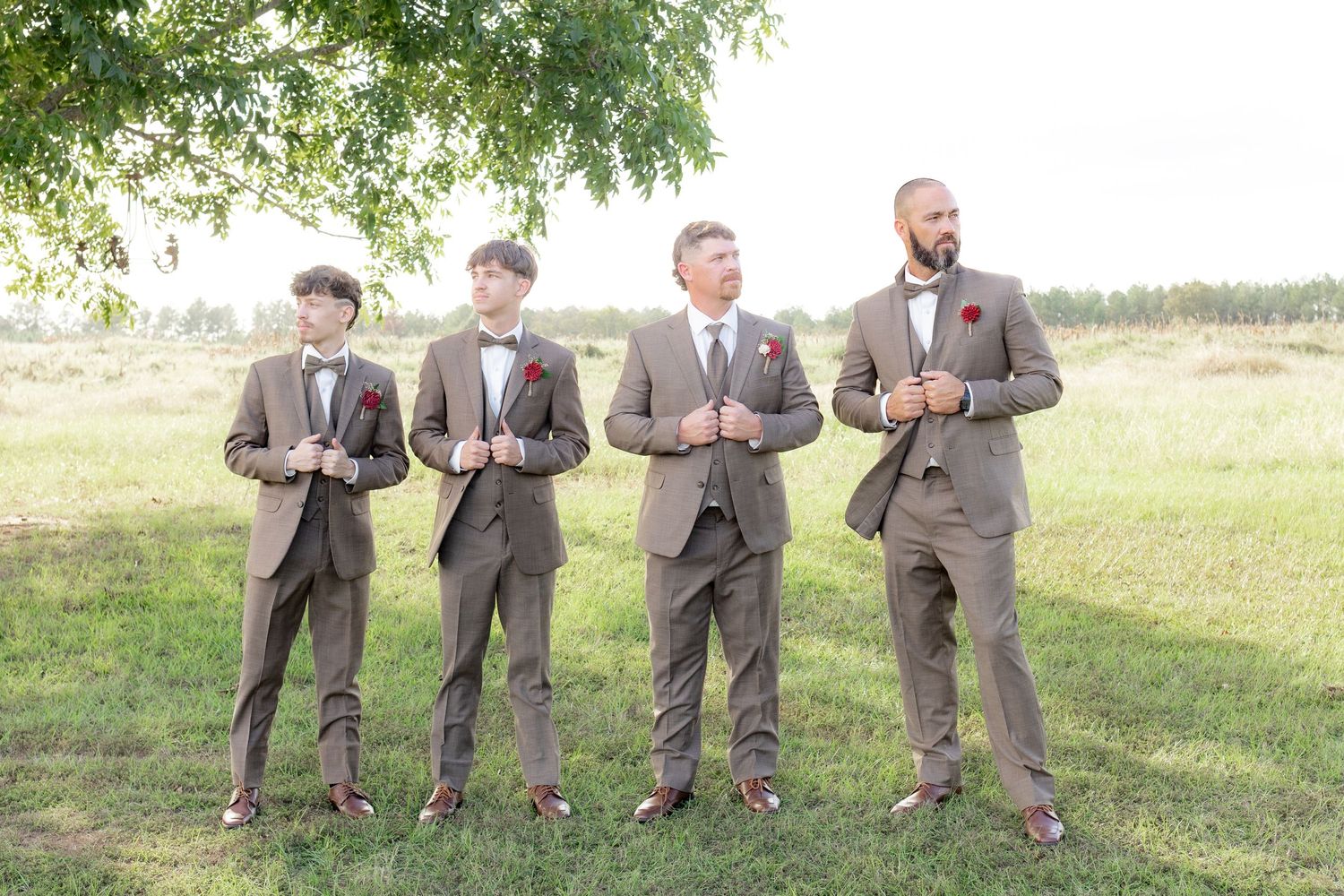Bridal party posing in a field at sunset at Hilltop Acres Wicksburg, Alabama
