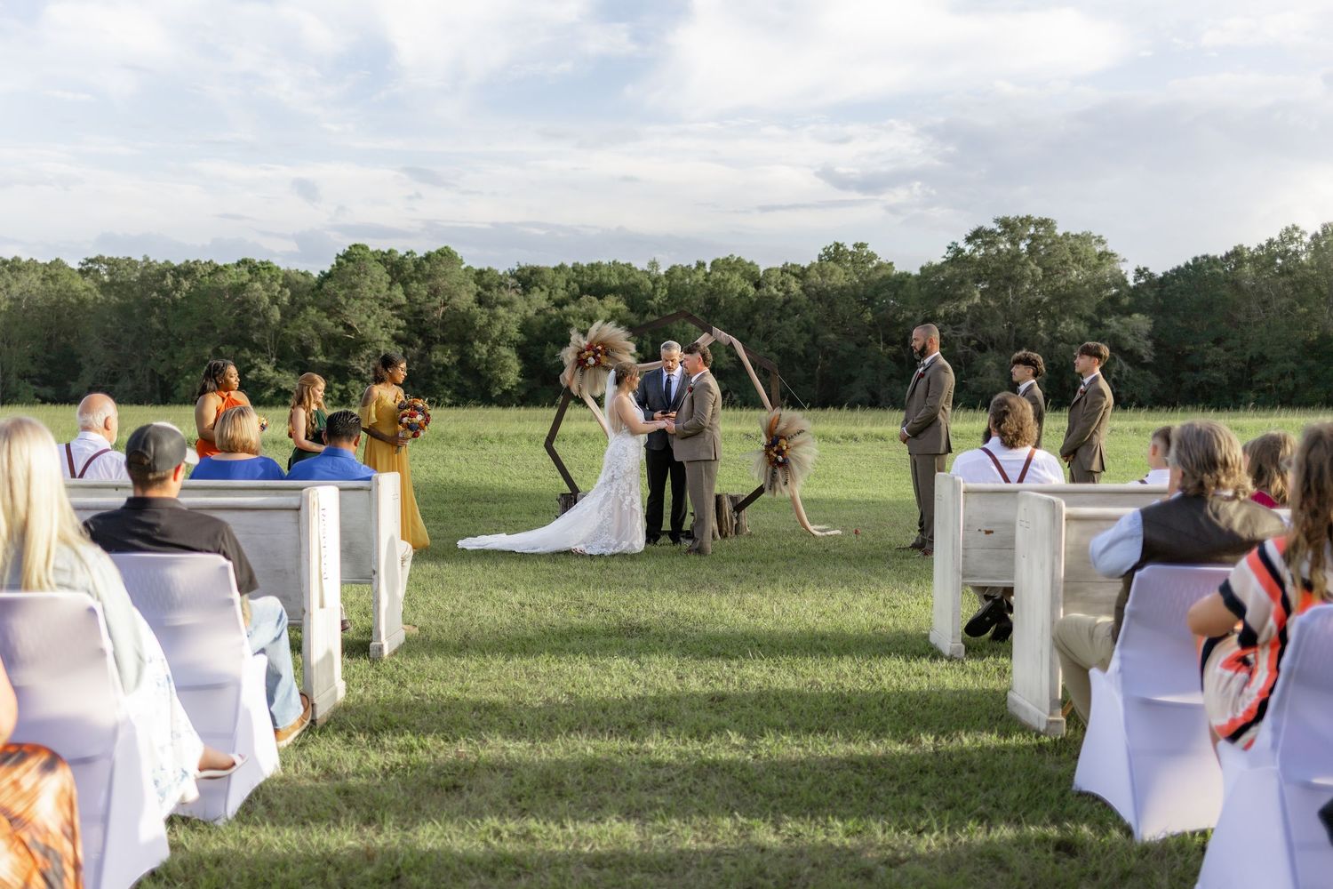 Bride and groom at the altar at their wedding at Hilltop Acres Wicksburg, Alabama