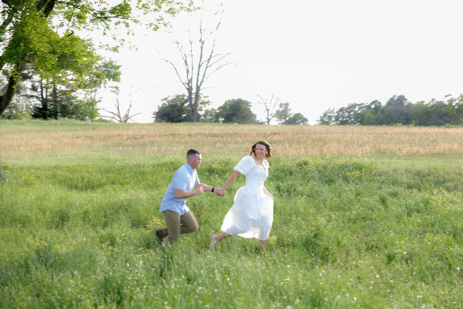 Storytelling romantic couple photos in a tall grass field at sunset in Dothan, Alabama