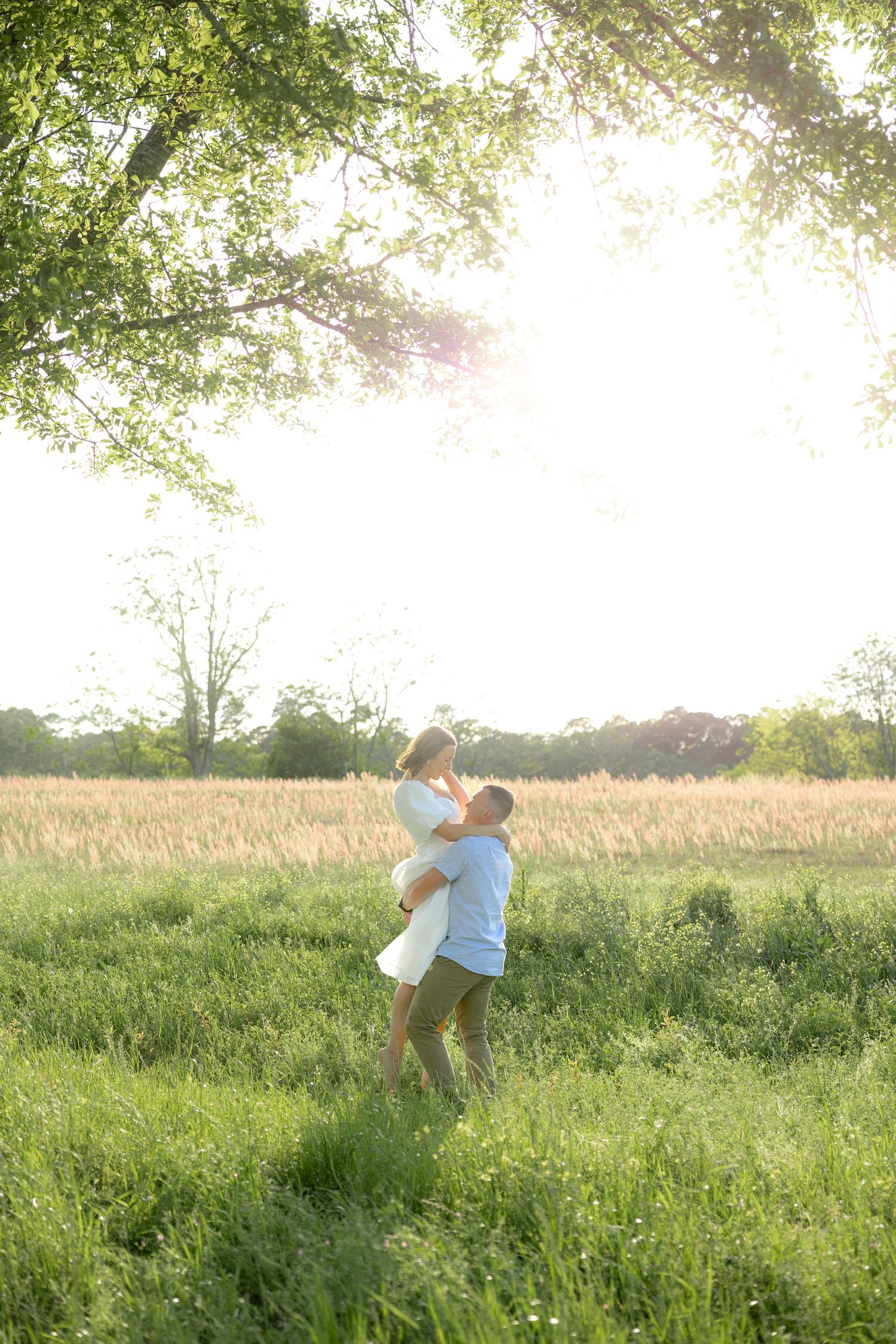 Storytelling couple photos in a tall grass field at sunset in Dothan, Alabama
