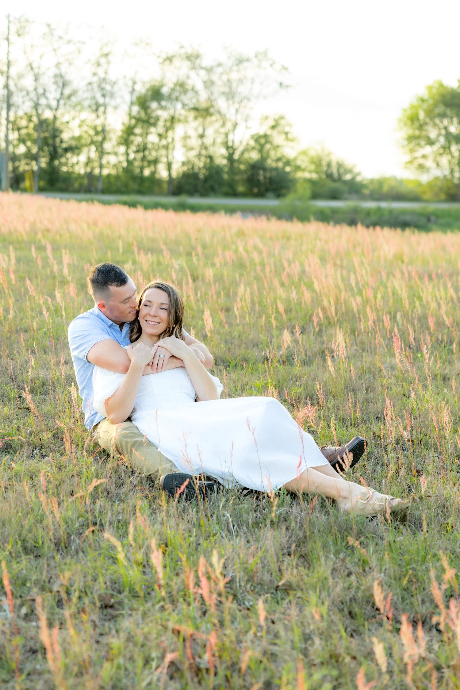 Storytelling couple photos in a tall grass field at sunset in Dothan, Alabama
