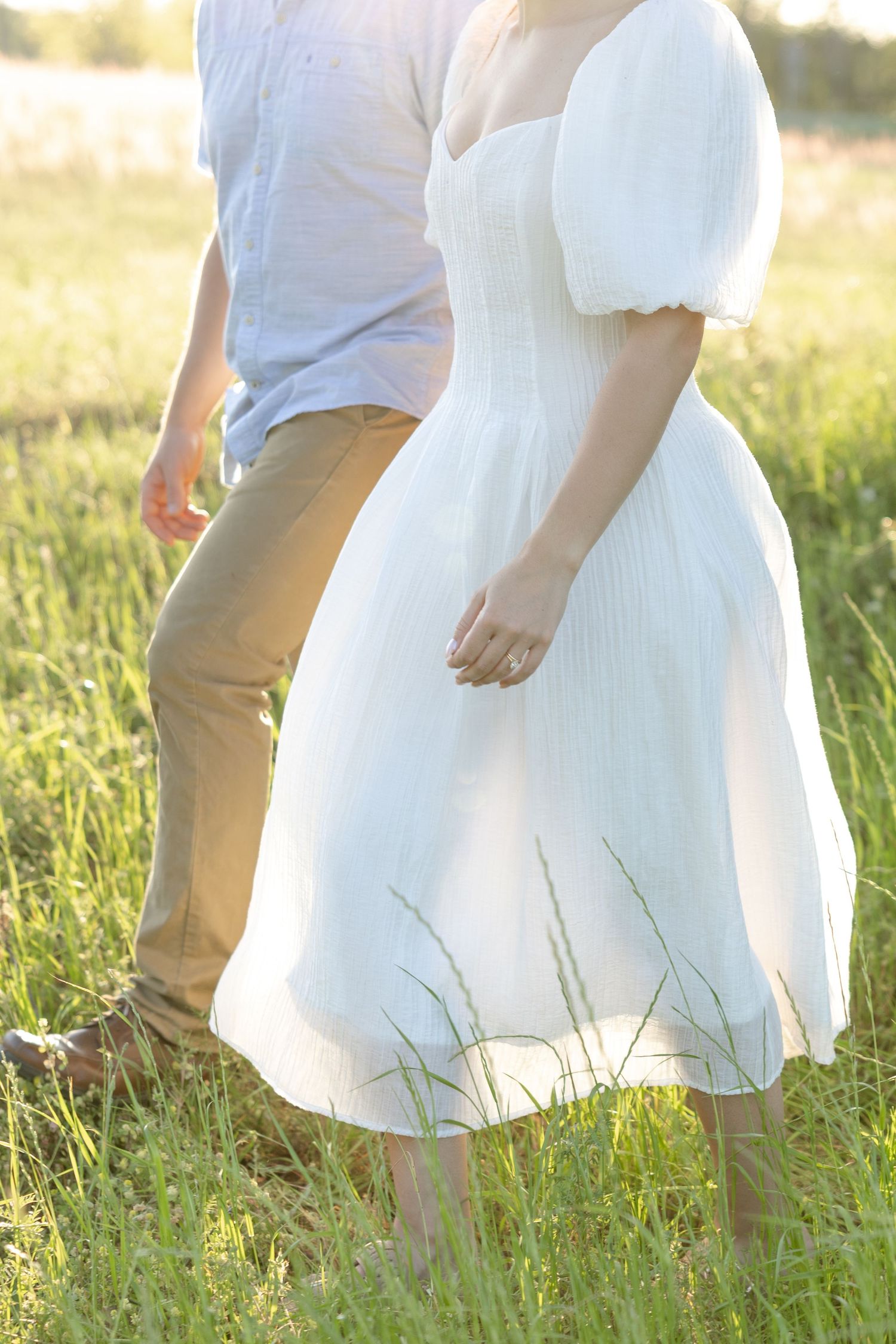 Storytelling couple photos in a tall grass field at sunset in Dothan, Alabama