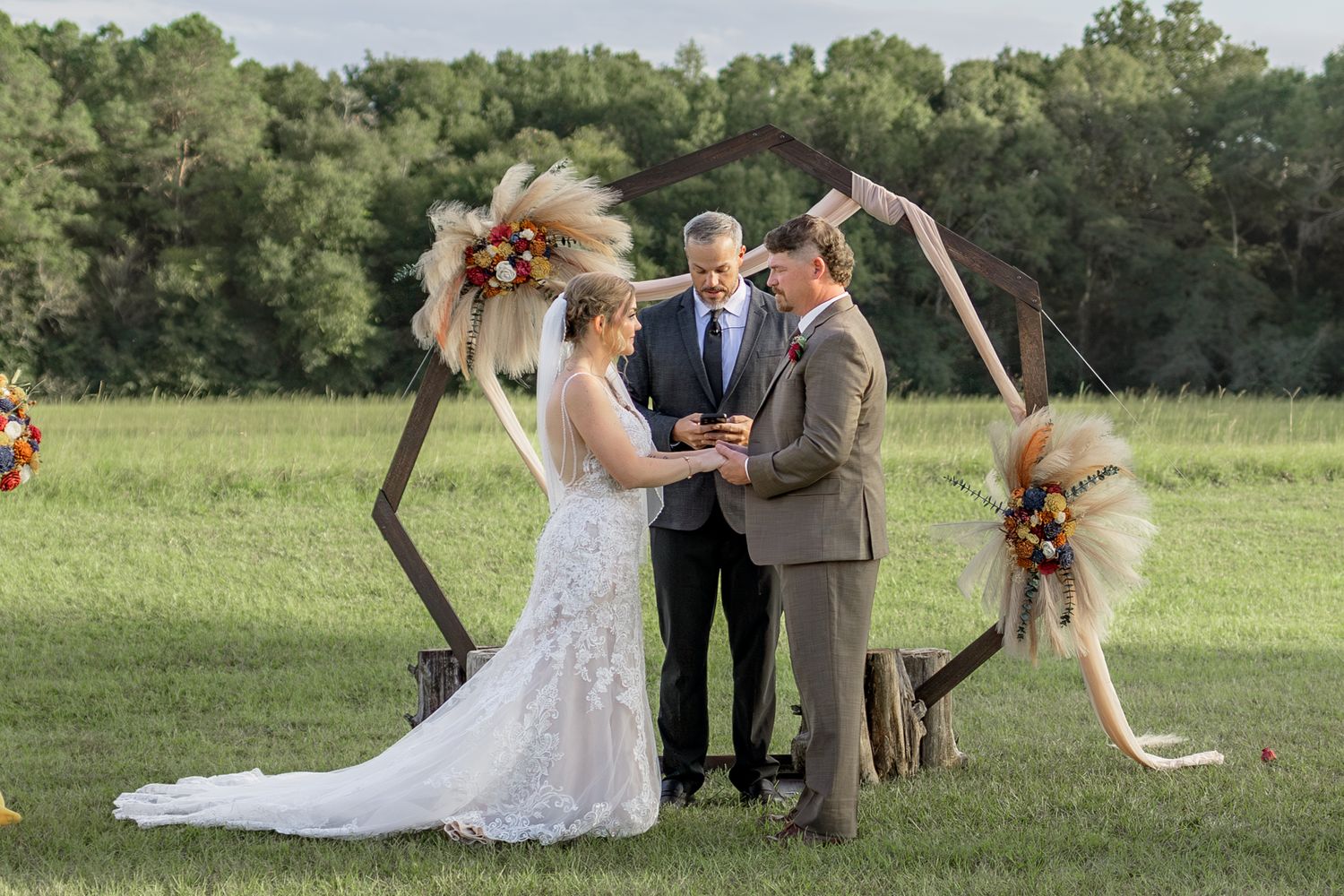 Bride and groom at the altar at their wedding at Hilltop Acres Wicksburg, Alabama