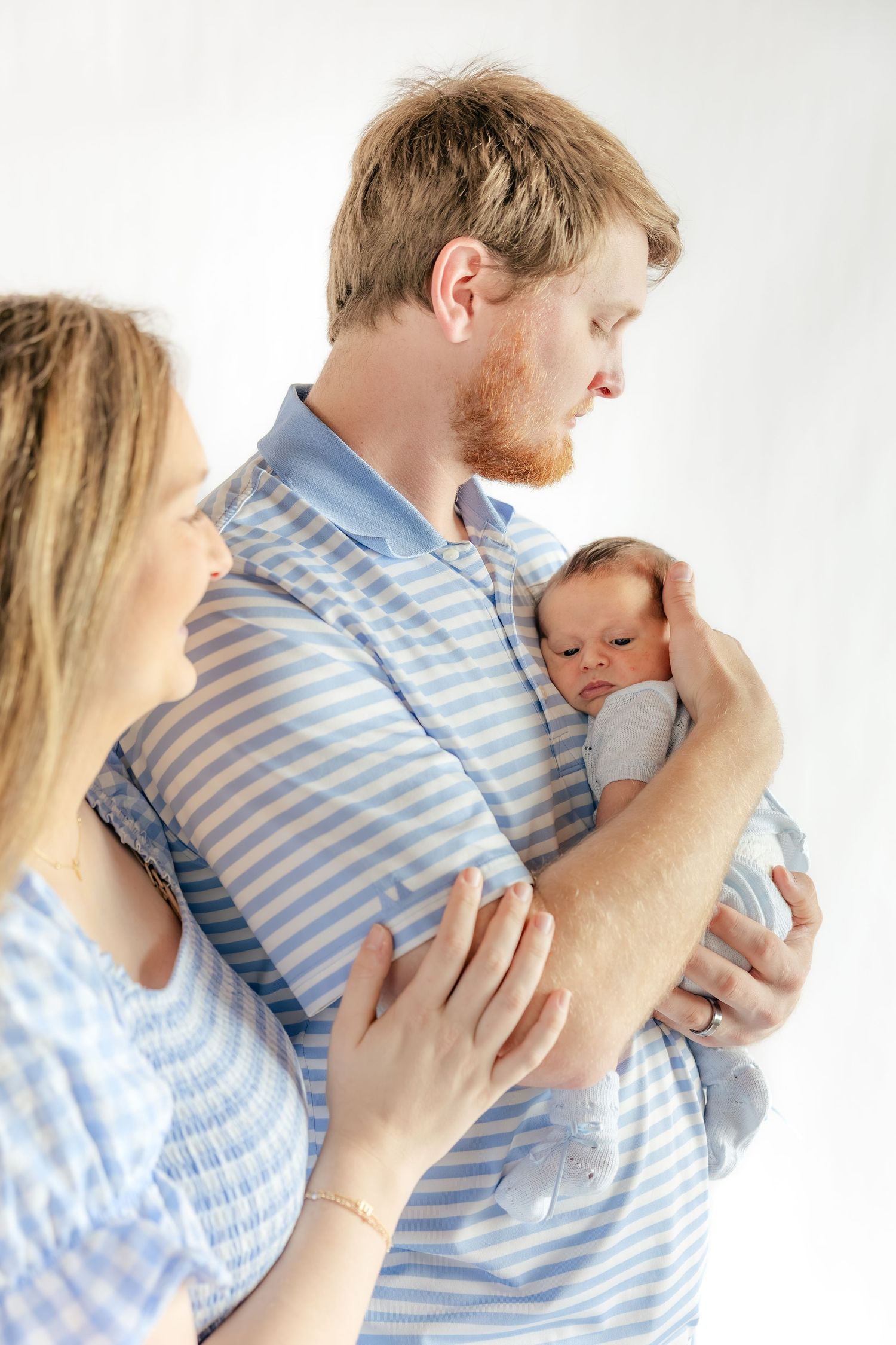 Family holding their baby in a studio in Dothan, Alabama