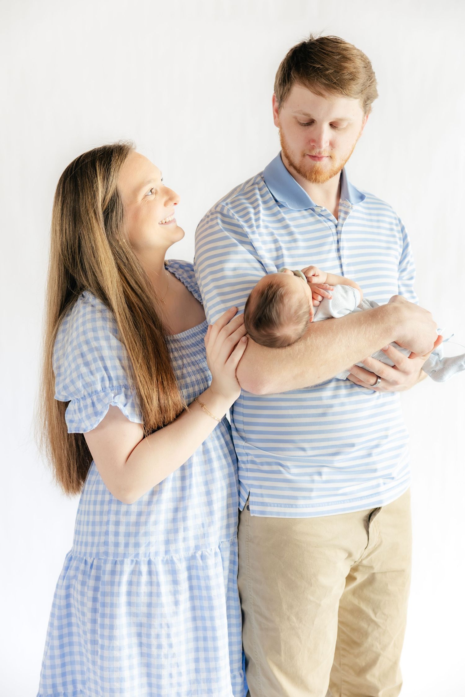 Family holding their baby in a studio in Dothan, Alabama