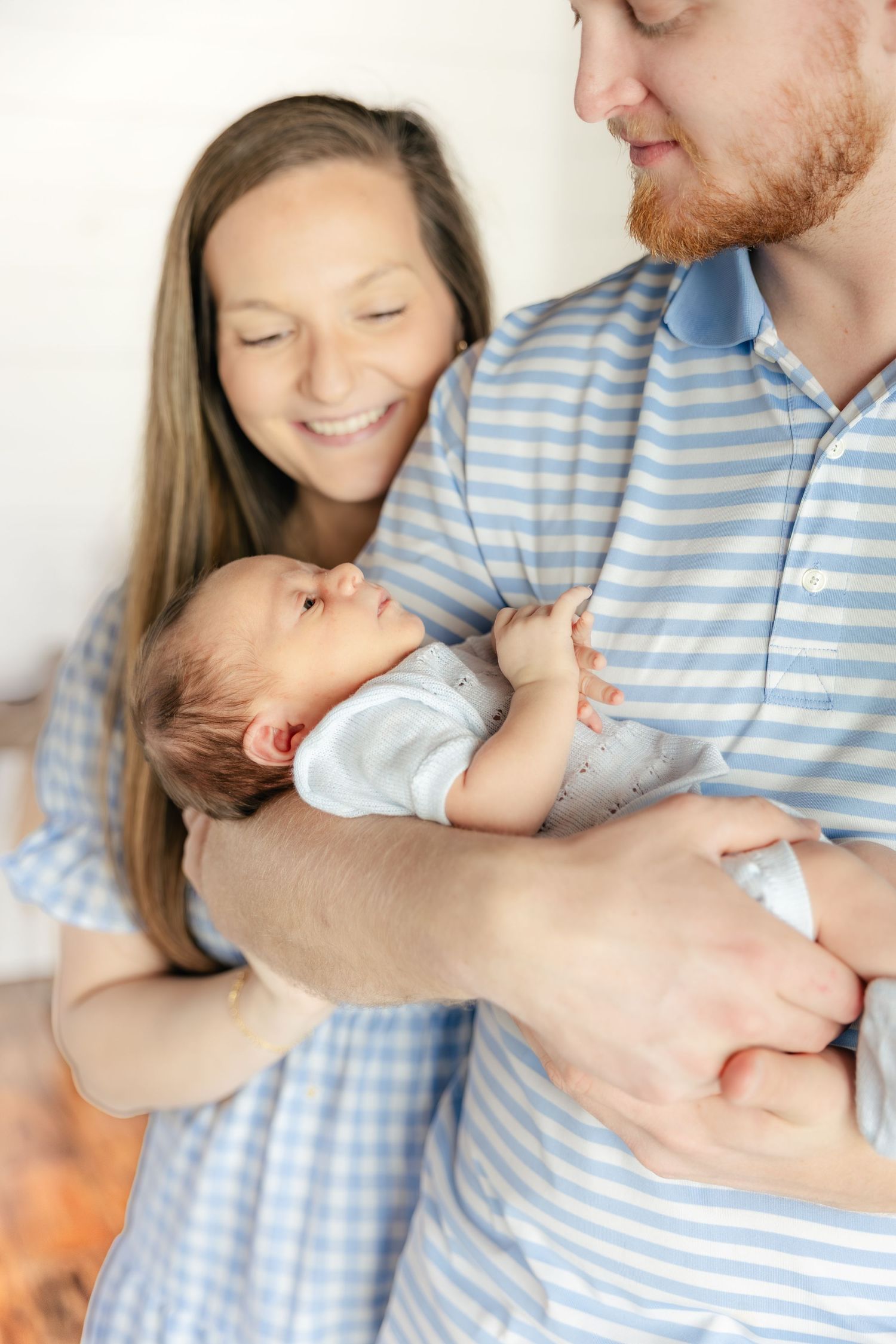 Family holding their baby in a studio in Dothan, Alabama