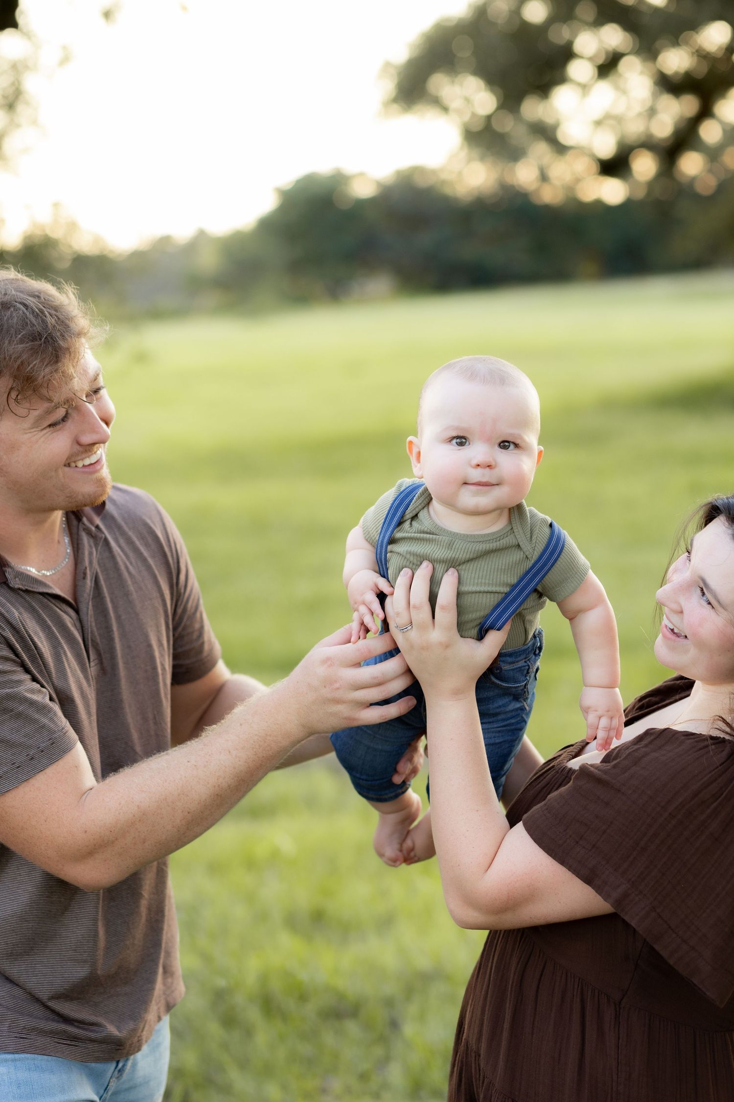 Family Pictures in a grass field at sunset near Dothan, Alabama