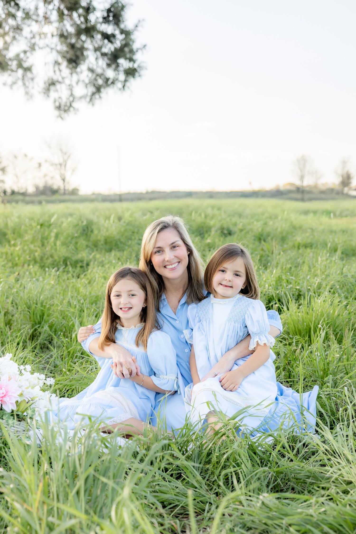 Spring Mini Session with baby chicks in a grass field at sunset near Dothan, Alabama