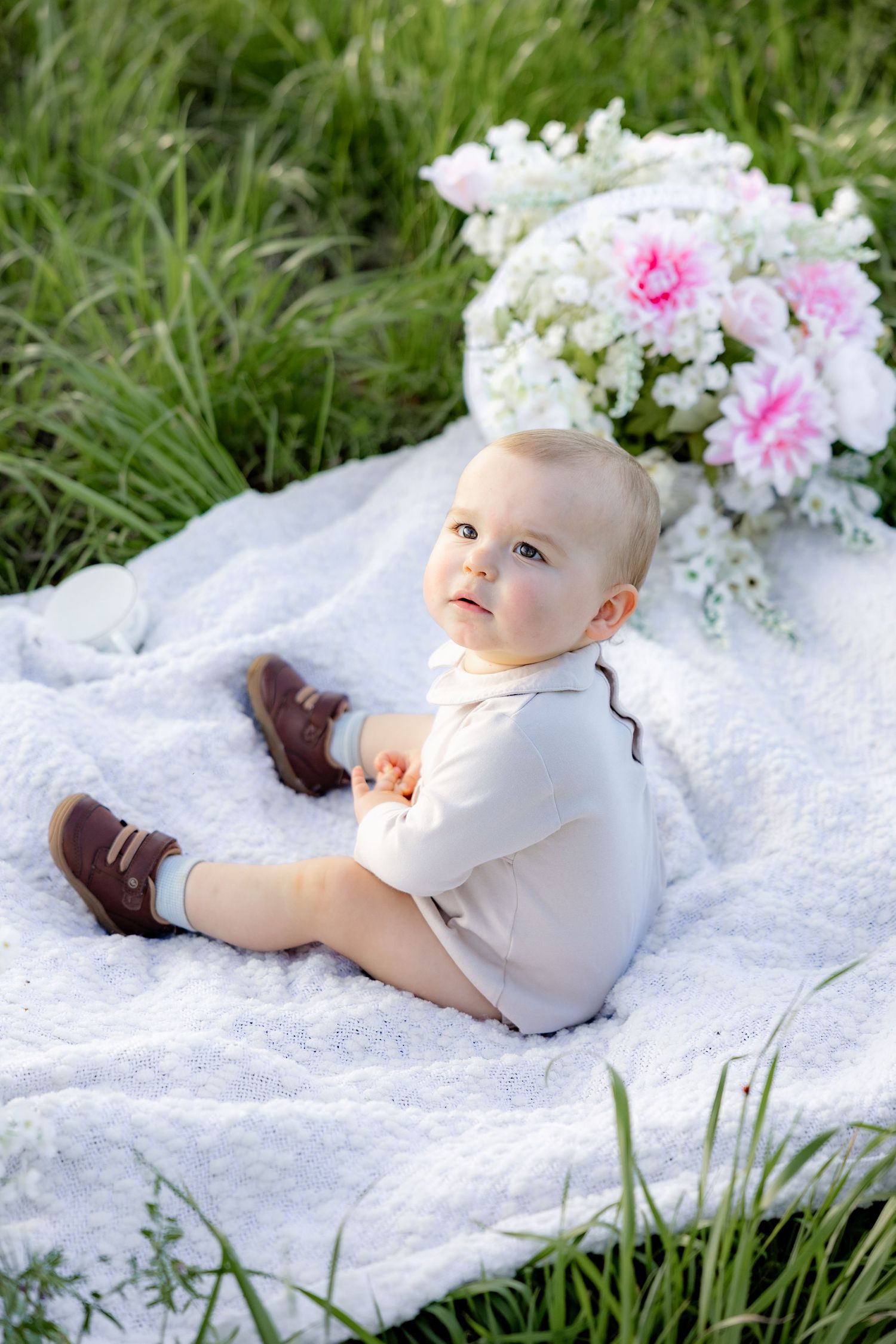 Spring Mini Session with baby chicks in a grass field at sunset near Dothan, Alabama