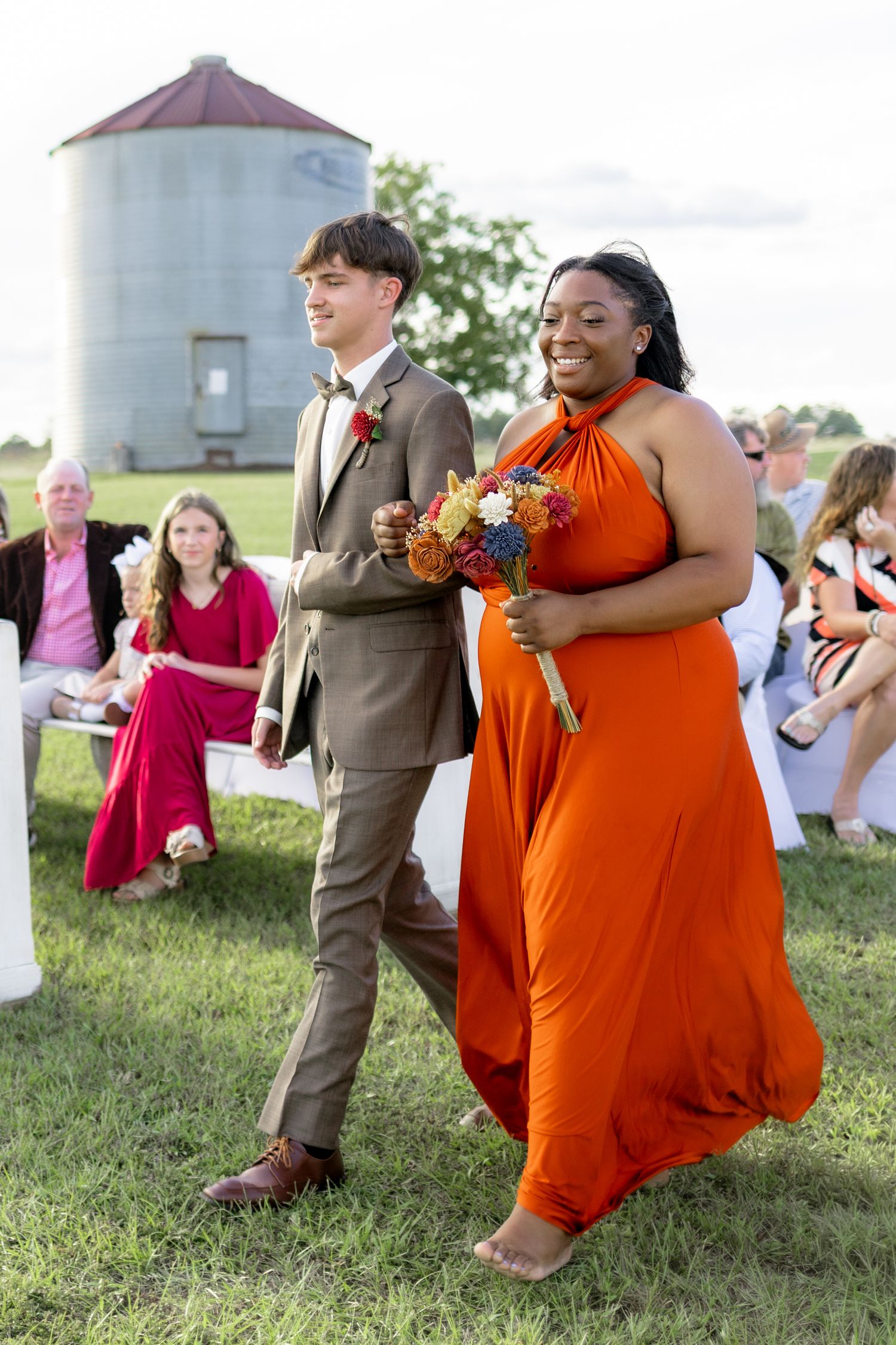 Bridal party walking down the aisle of a wedding at Hilltop Acres Wicksburg, Alabama