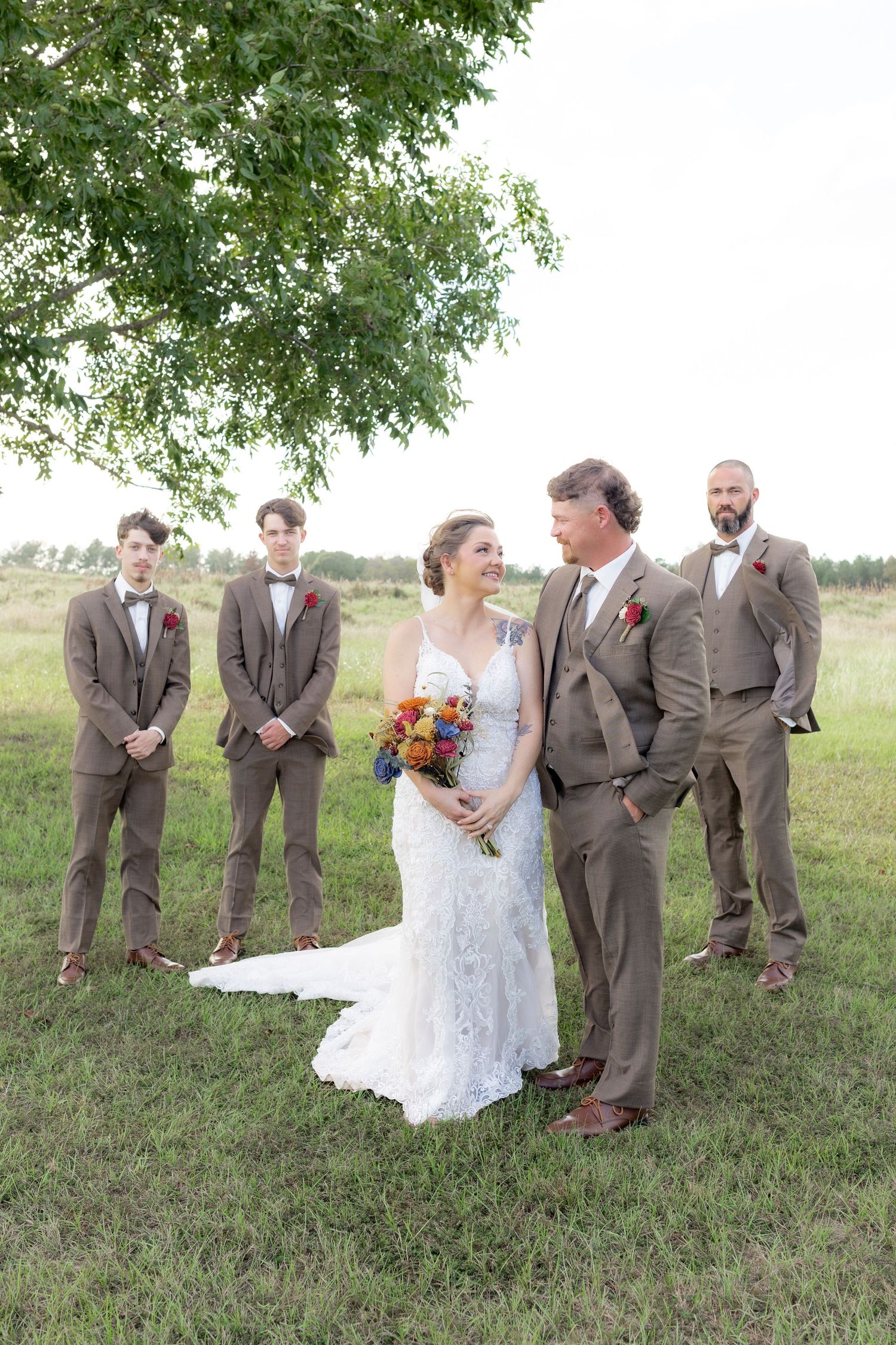 Bridal party posing in a field at sunset at Hilltop Acres Wicksburg, Alabama