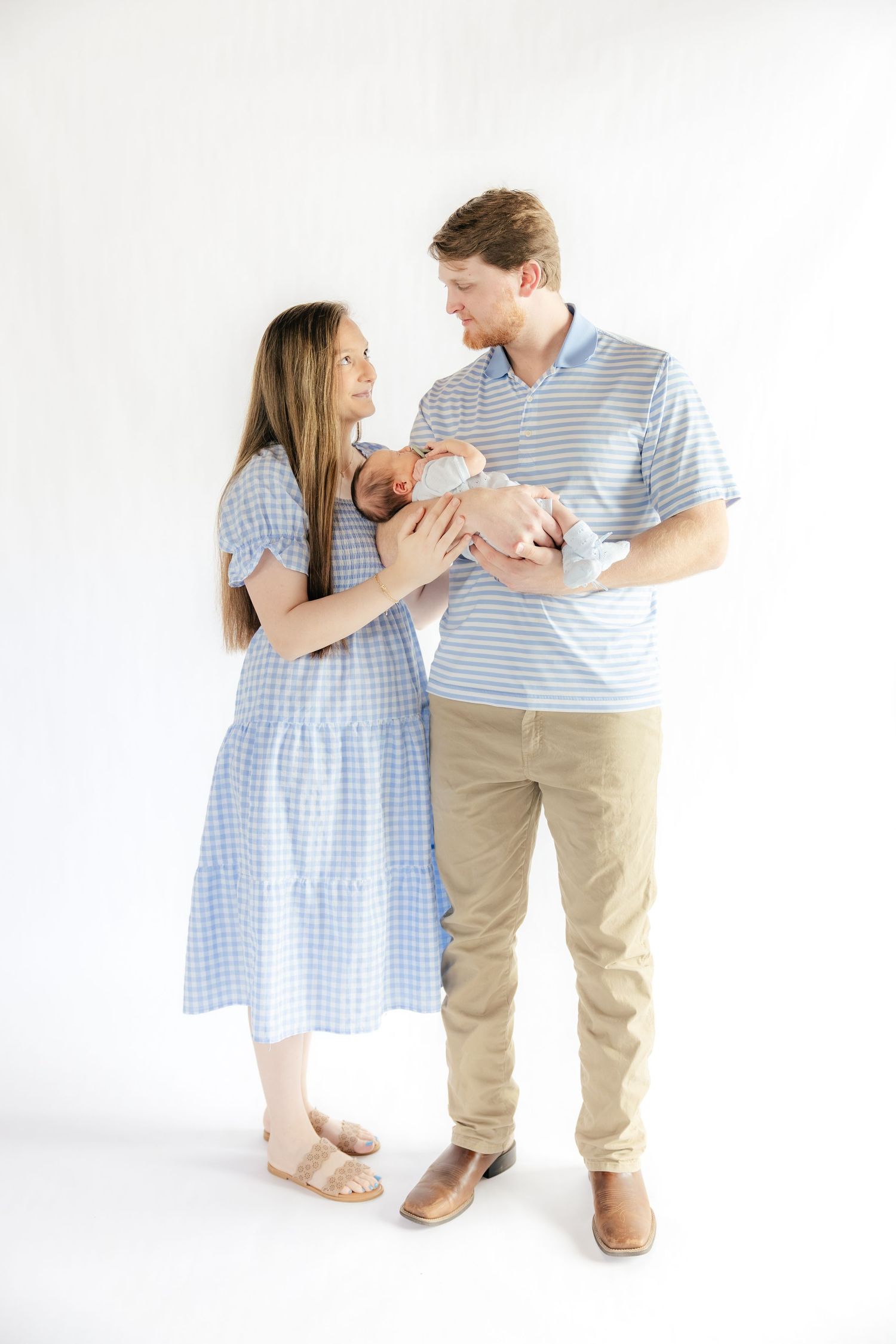 Family holding their baby in a studio in Dothan, Alabama