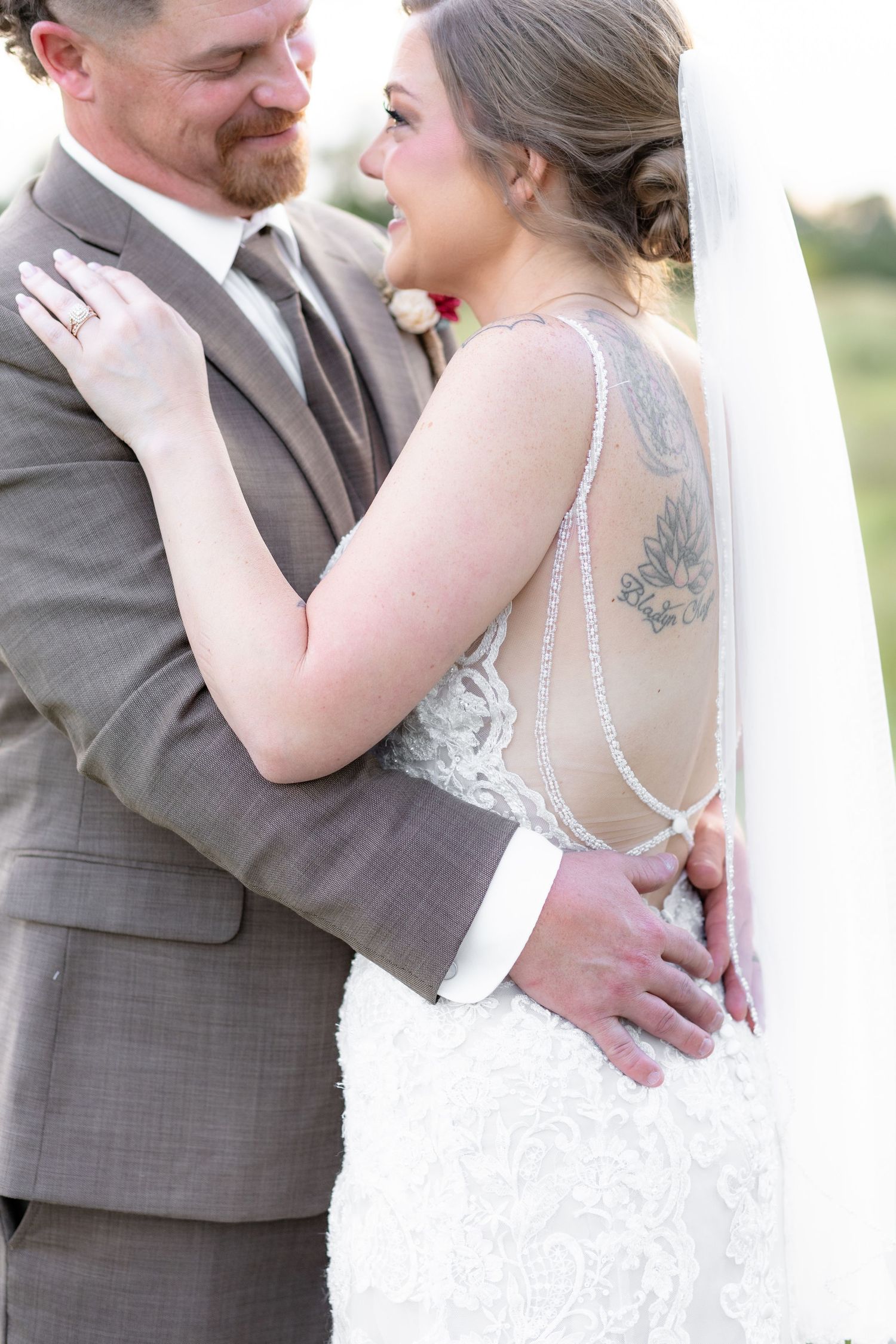 Bride and groom hold each other at sunset at Hilltop Acres Wicksburg, Alabama
