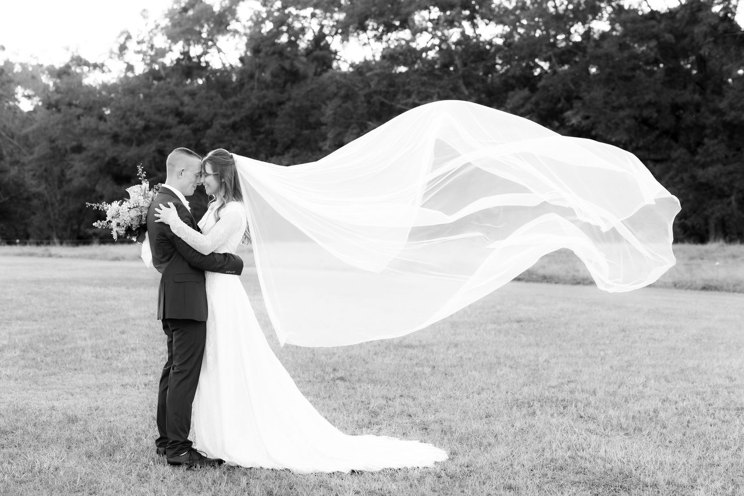 Bride and groom holding each other for portraits at Dalrymple Farms Enterprise, Alabama