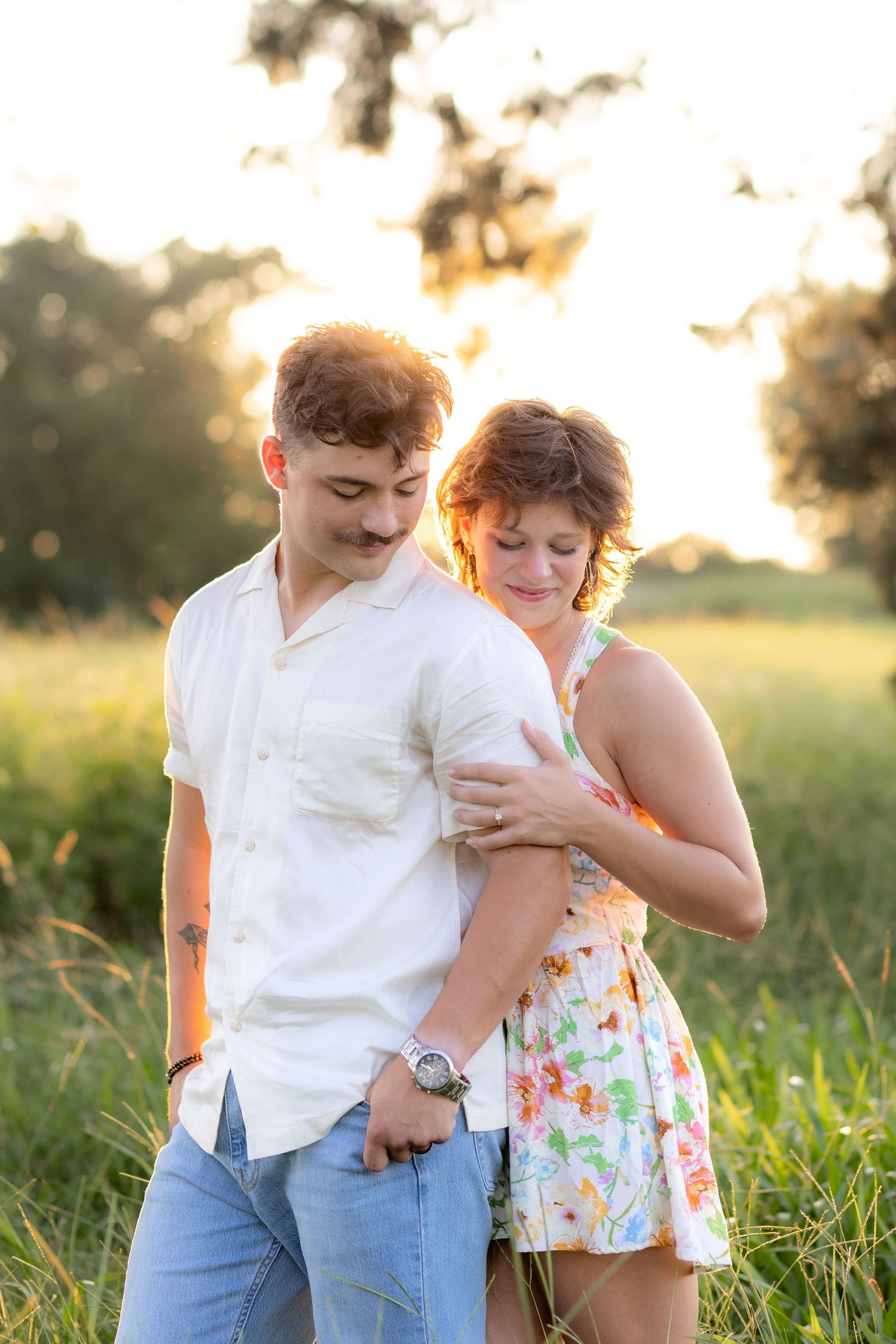 Romantic Couples photos in a tall grass field at sunset near Dothan, Alabama