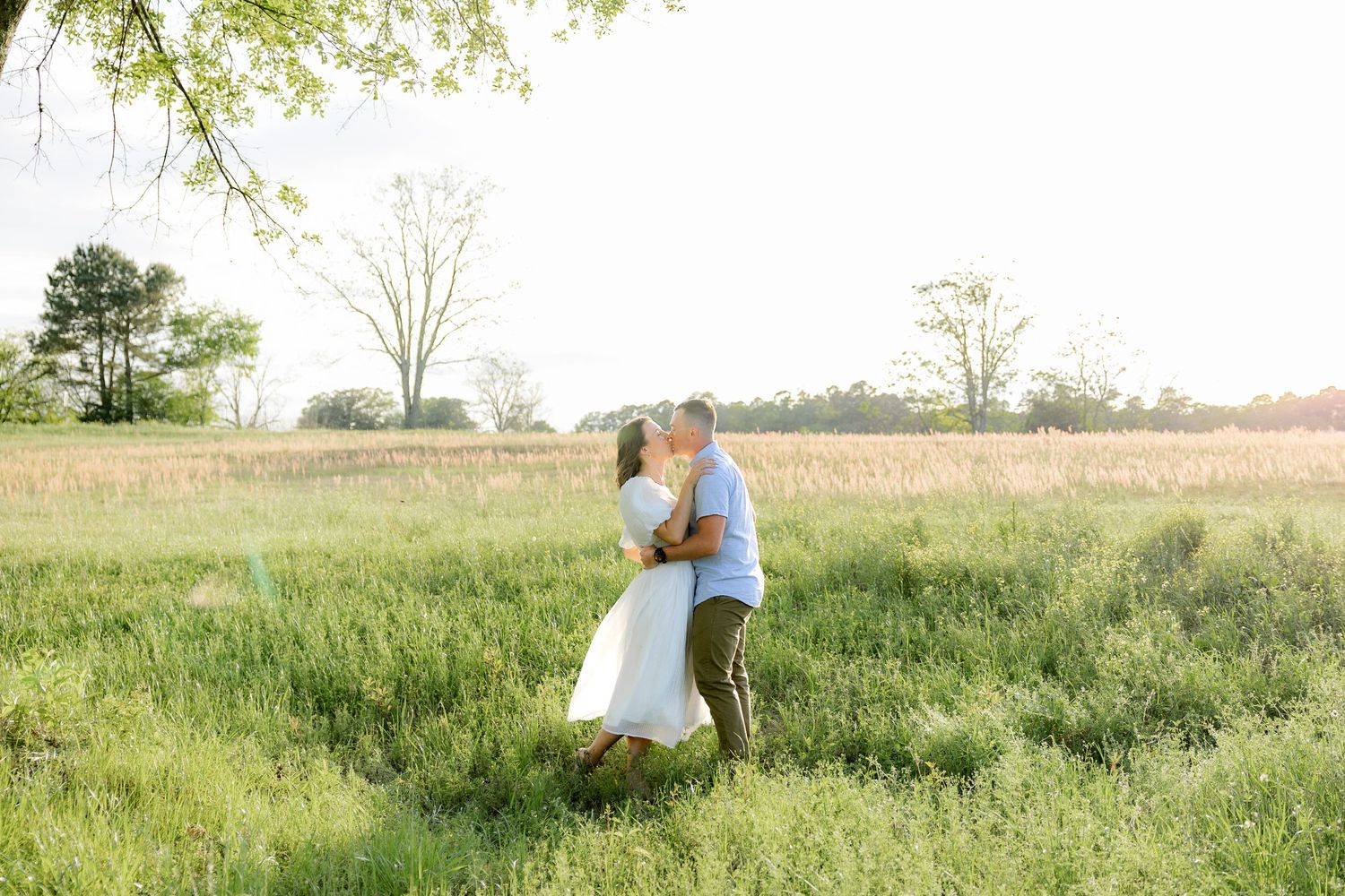 Storytelling couple photos in a tall grass field at sunset in Dothan, Alabama