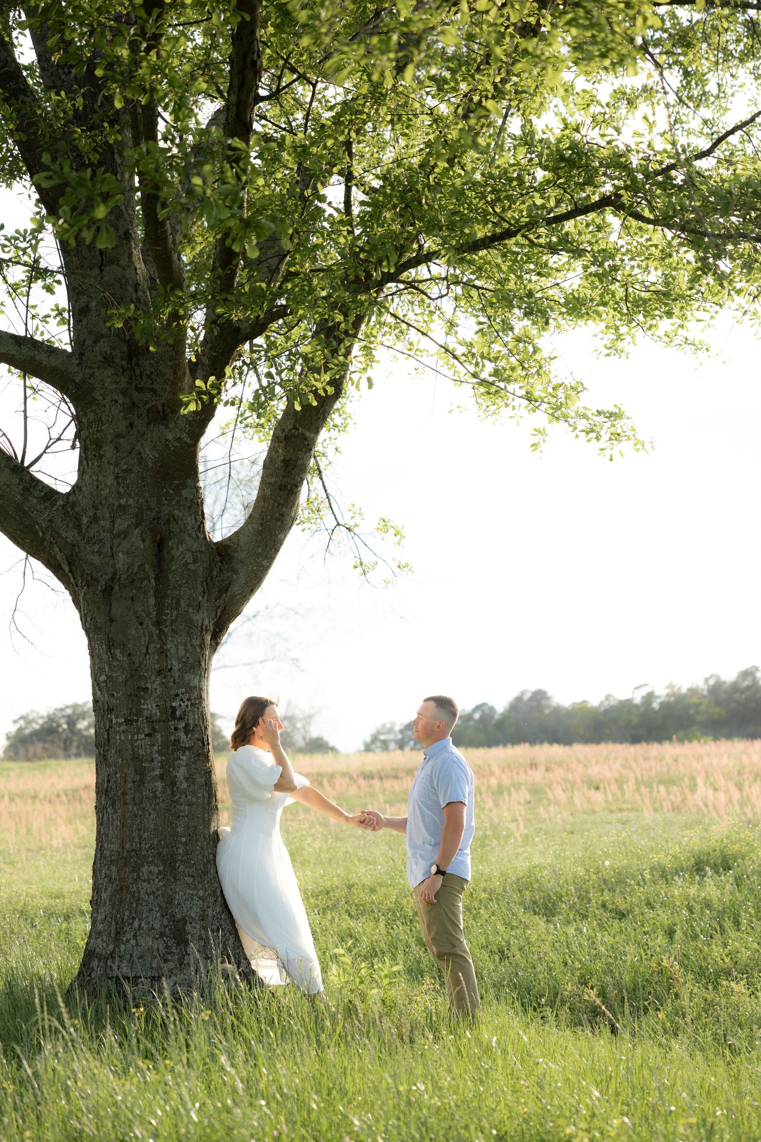 Storytelling romantic couple photos in a tall grass field at sunset in Dothan, Alabama