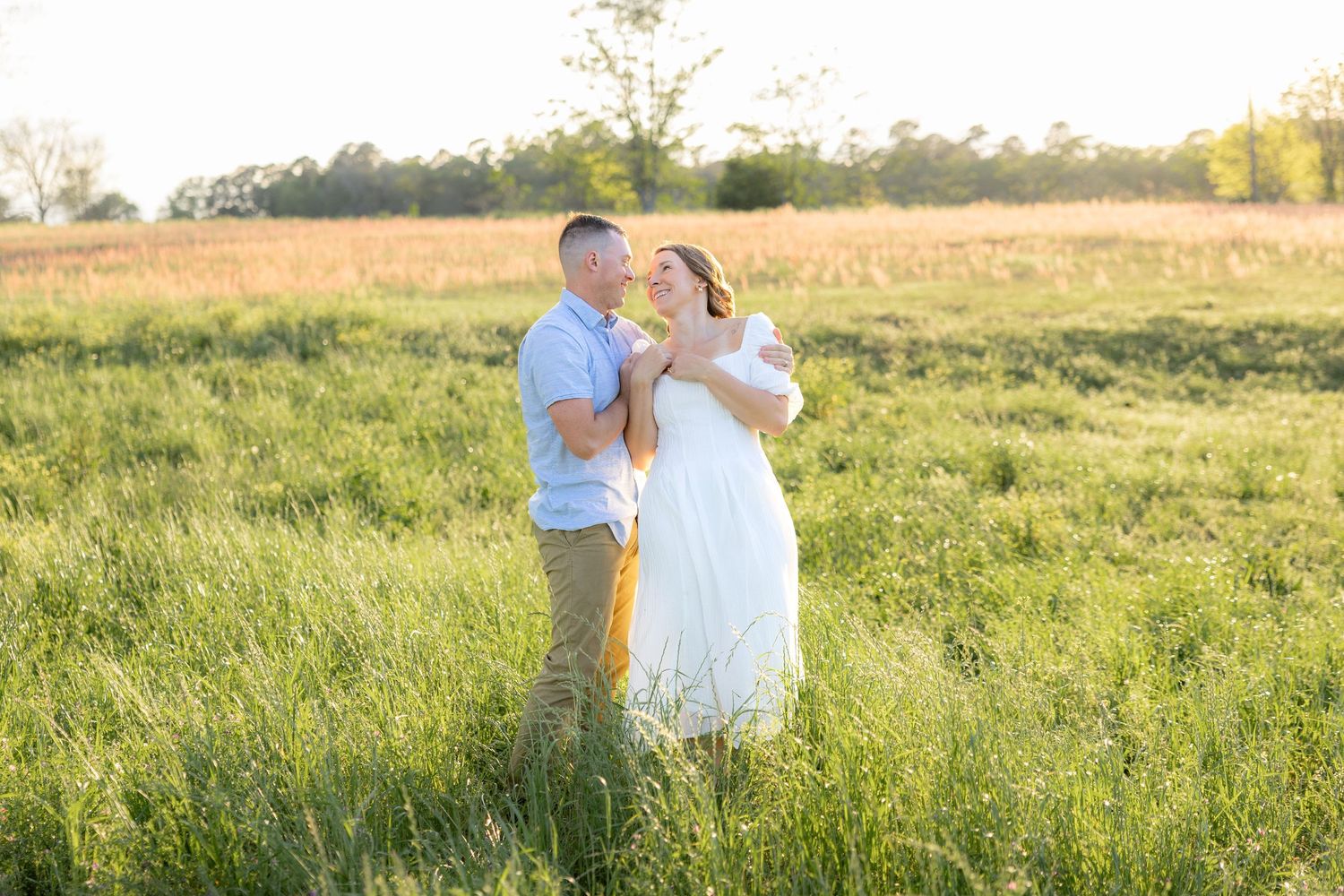 Storytelling couple photos in a tall grass field at sunset in Dothan, Alabama