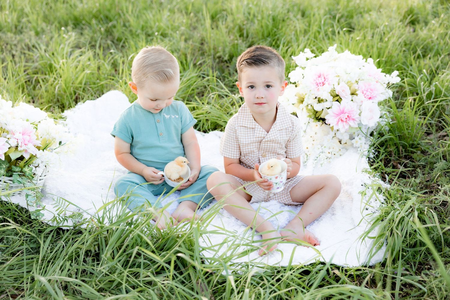 Spring Mini Session with baby chicks in a grass field at sunset near Dothan, Alabama