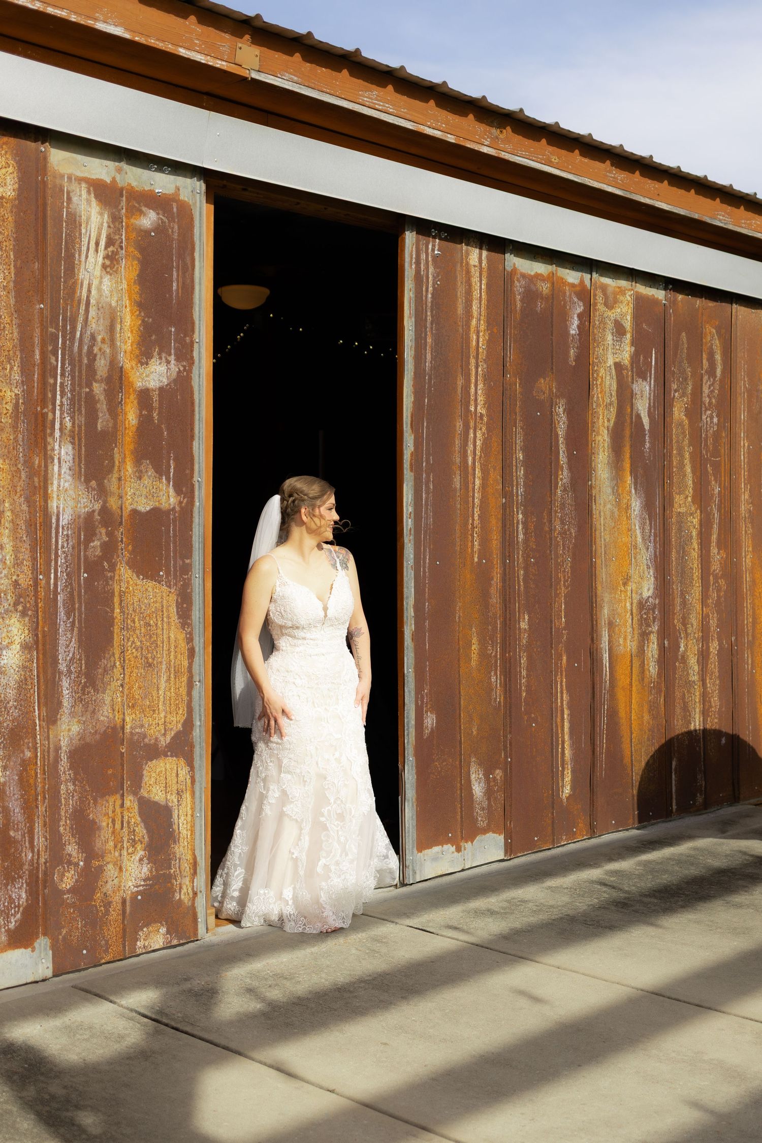Bride walking to first look underneath the gazebo at Hilltop Acres Wicksburg, Alabama