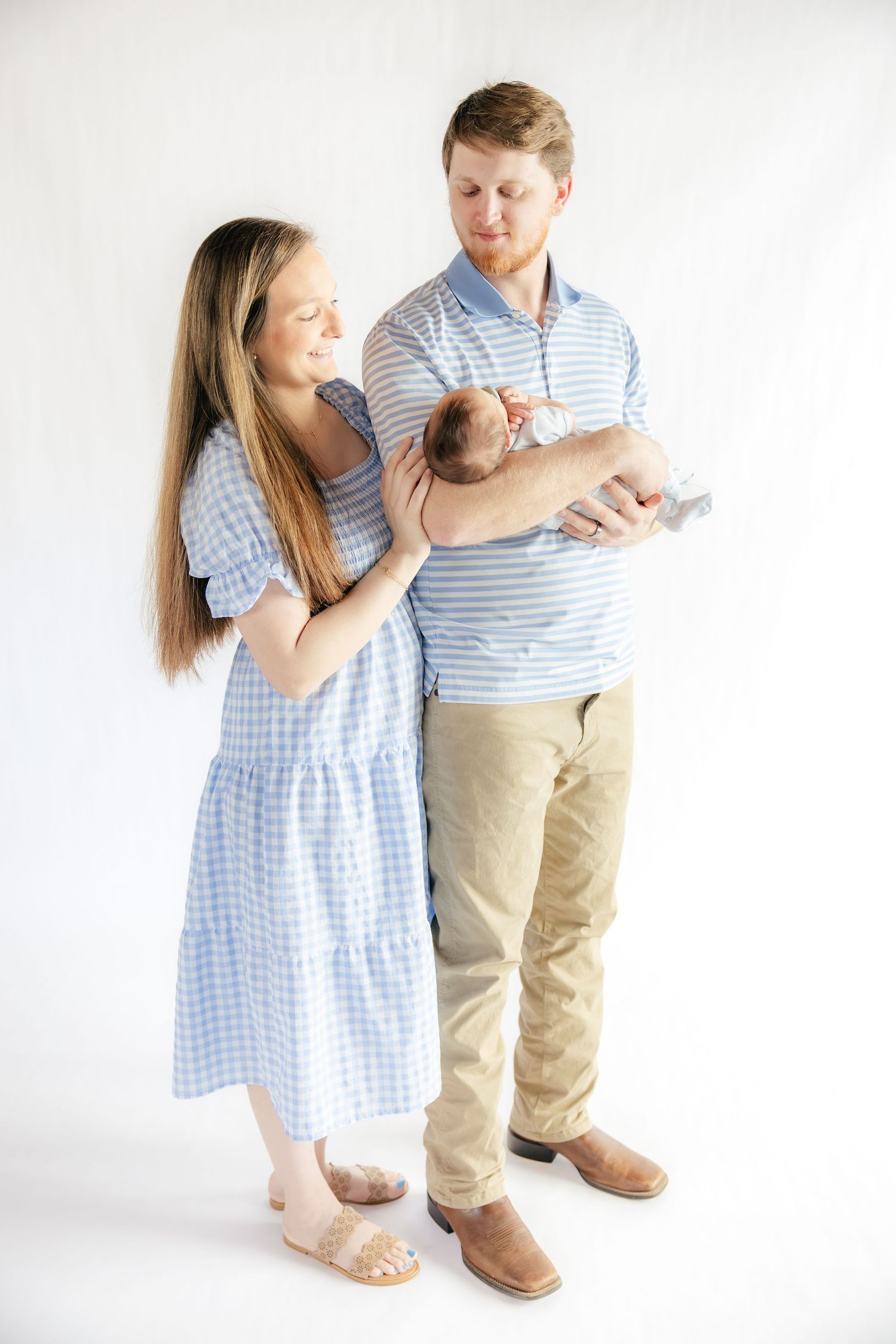 Family holding their baby in a studio in Dothan, Alabama