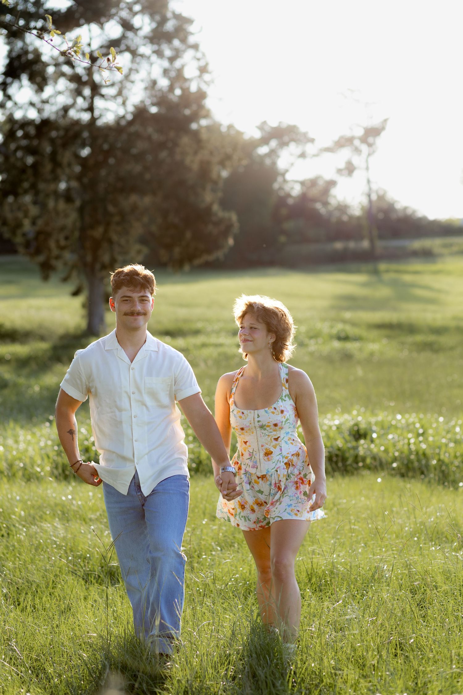 Romantic Couples photos in a tall grass field at sunset near Dothan, Alabama