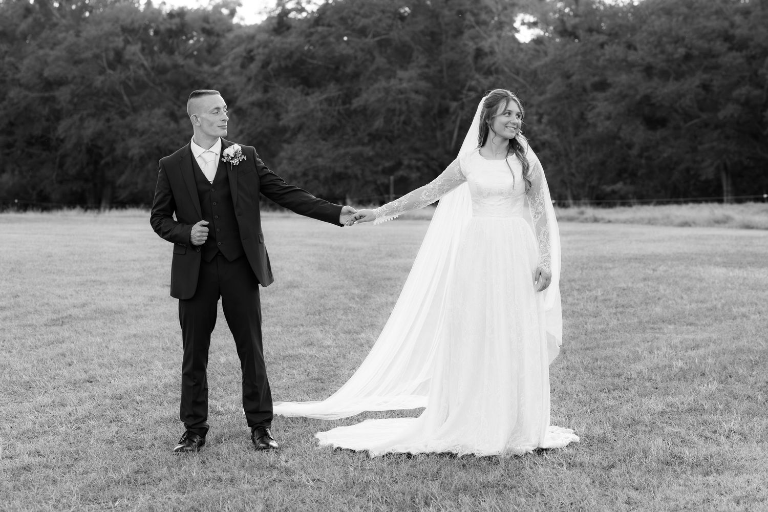 Bride and groom holding hands for portraits at Dalrymple Farms Enterprise, Alabama