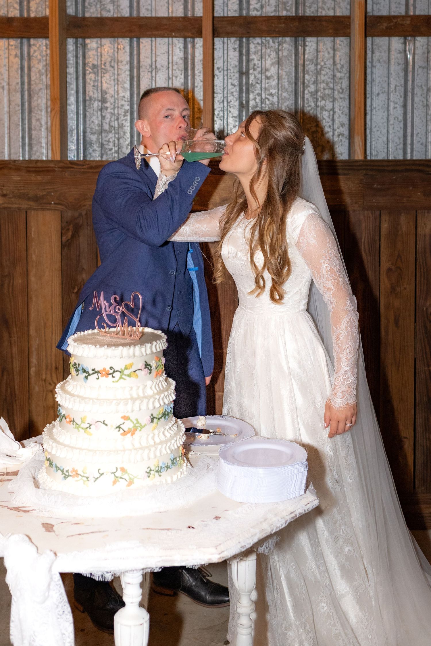Bride and groom cut cake at their reception at Dalrymple Farms Enterprise, Alabama
