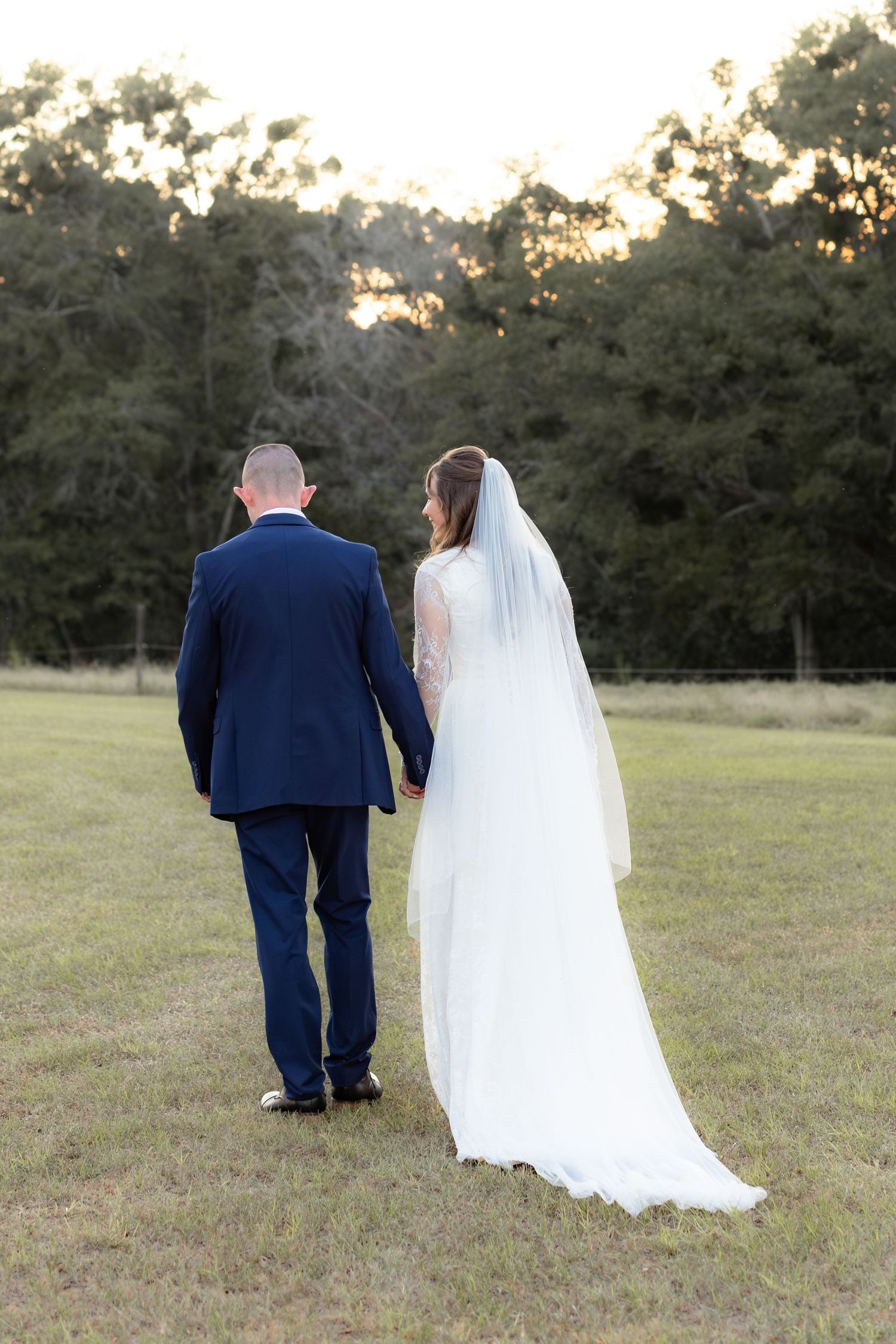 Bride and groom holding hands for portraits at Dalrymple Farms Enterprise, Alabama