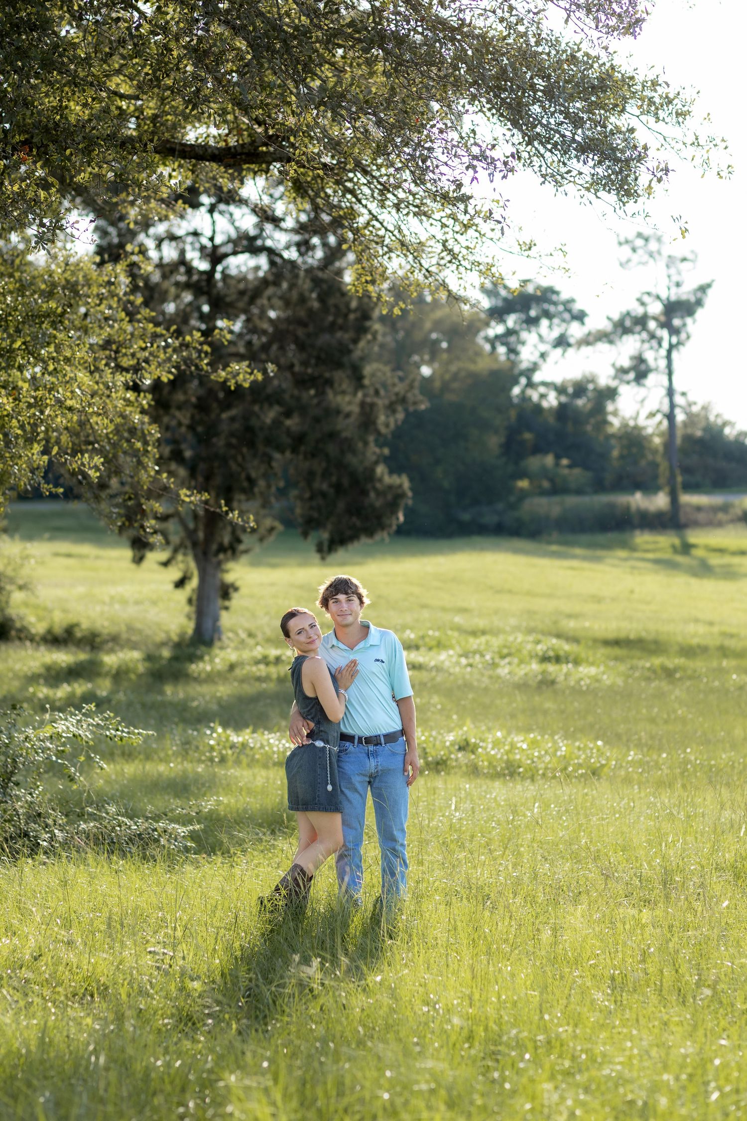 Romantic Couples photos in a tall grass field at sunset near Dothan, Alabama