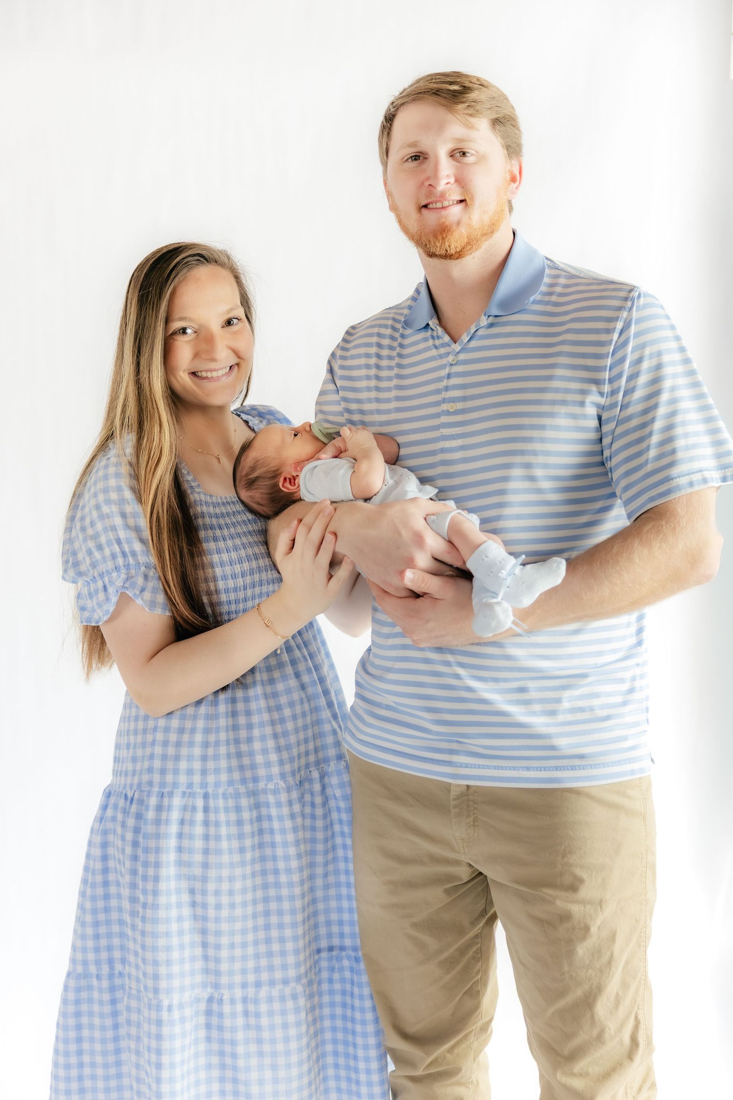 Family holding their baby in a studio in Dothan, Alabama