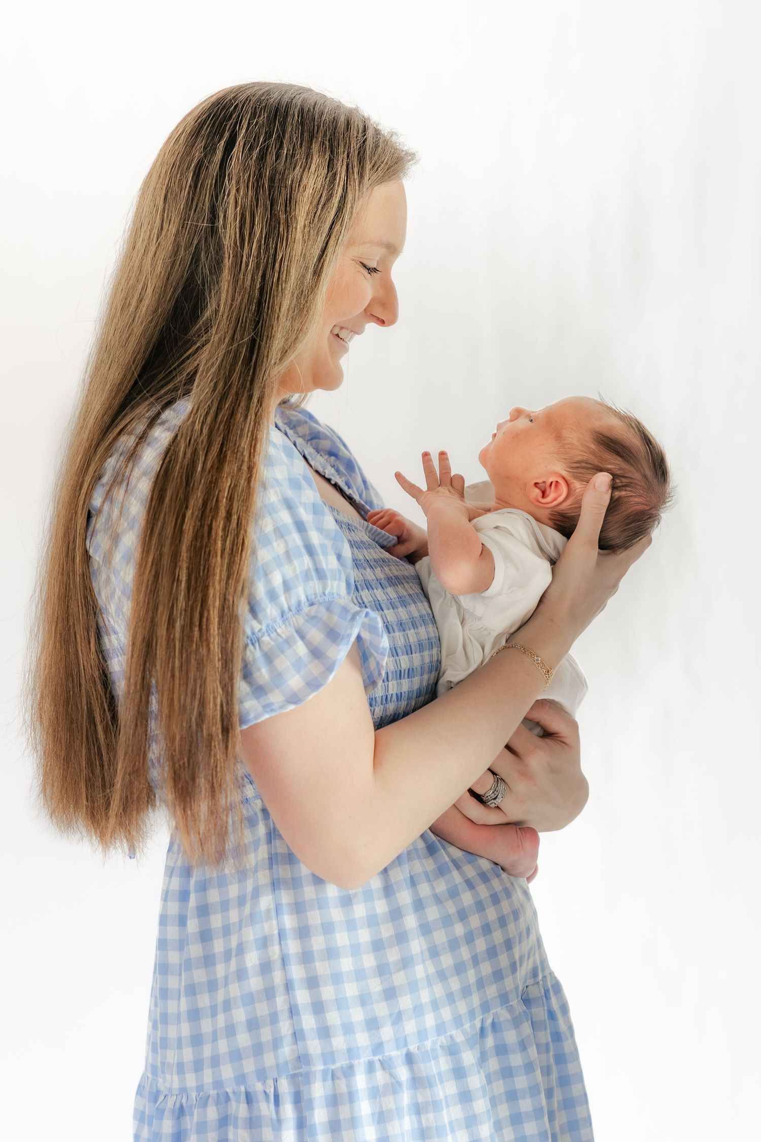 Mother holding her baby in a studio in Dothan, Alabama