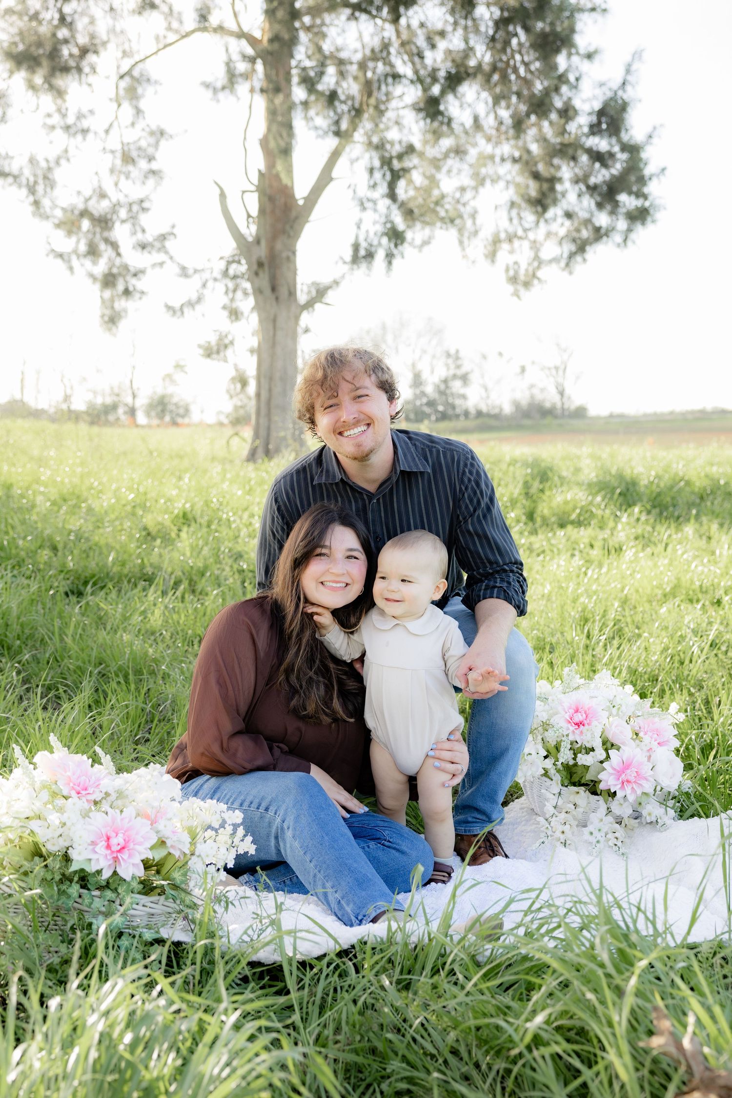 Spring Mini Session with baby chicks in a grass field at sunset near Dothan, Alabama