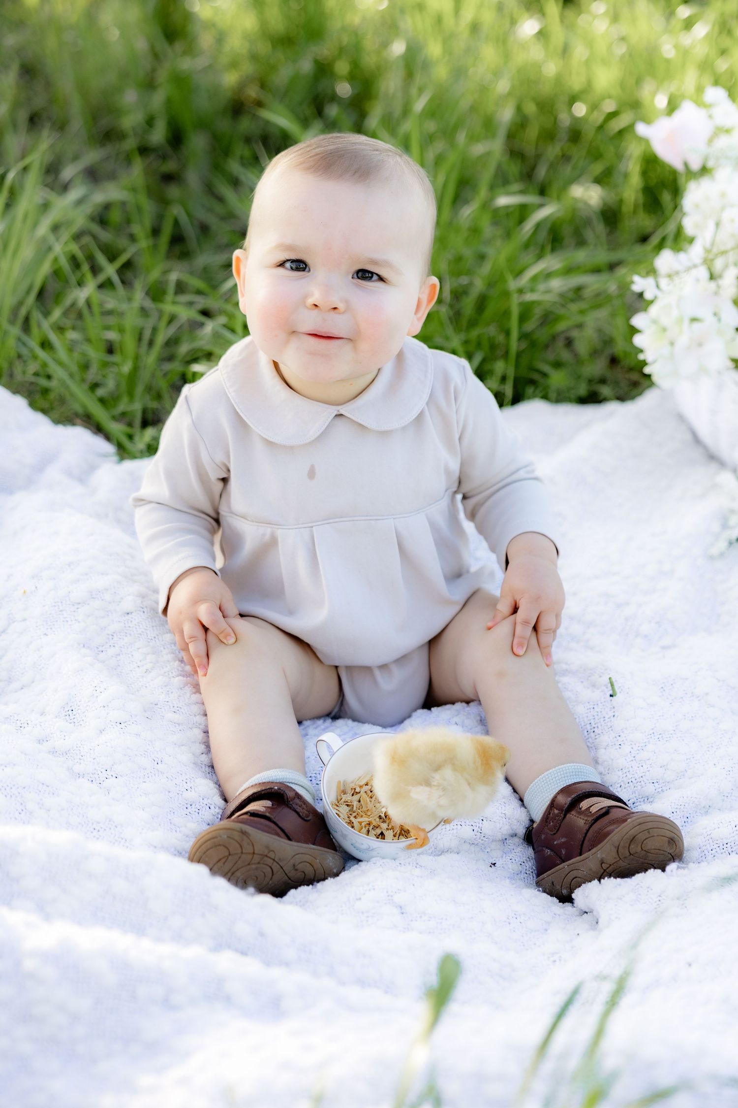 Spring Mini Session with baby chicks in a grass field at sunset near Dothan, Alabama